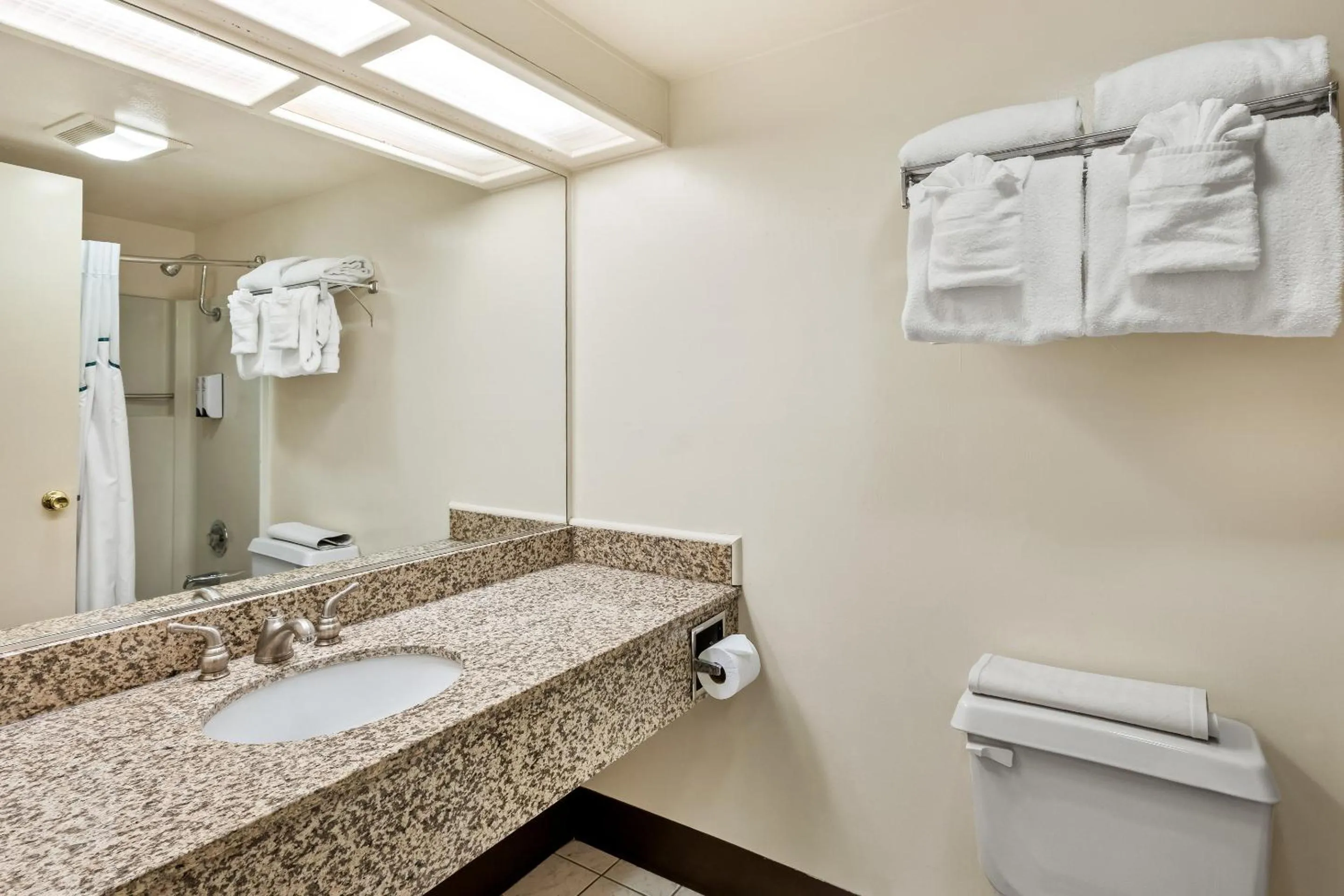 Bathroom in HomeTowne Studios by Red Roof Yuba City Bonanza - Marysville