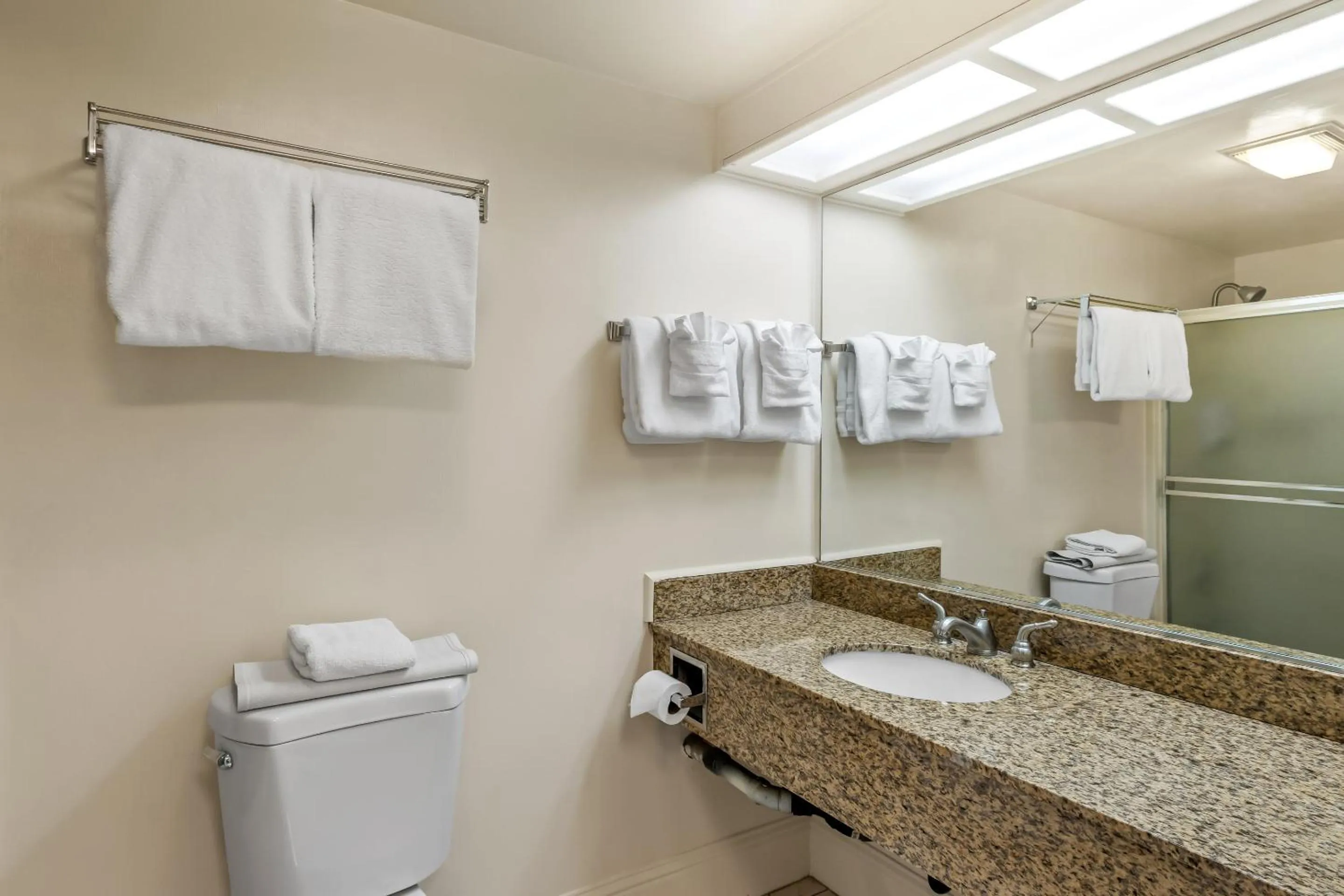 Bathroom in HomeTowne Studios by Red Roof Yuba City Bonanza - Marysville