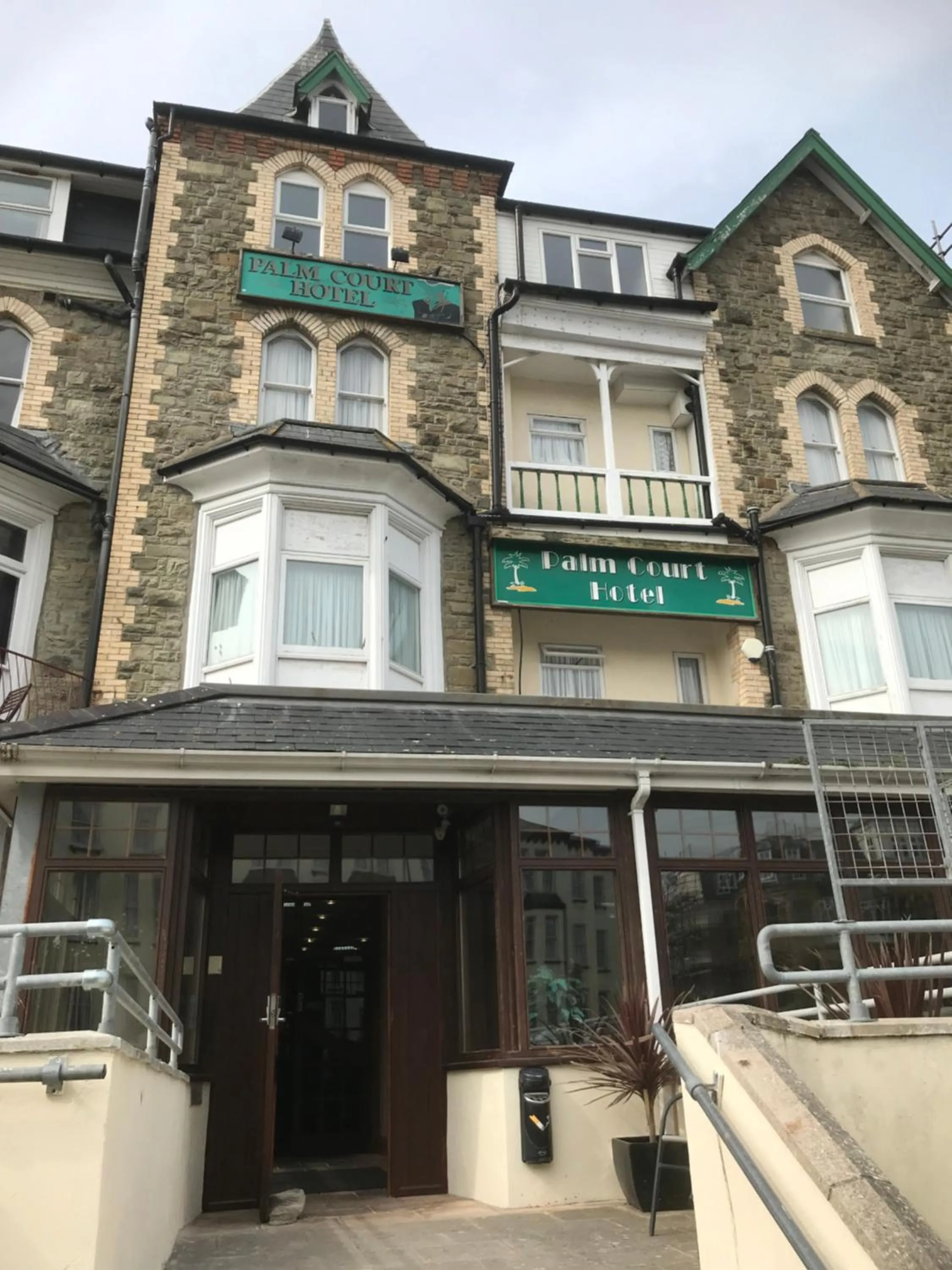 Property building in Palm Court B&B