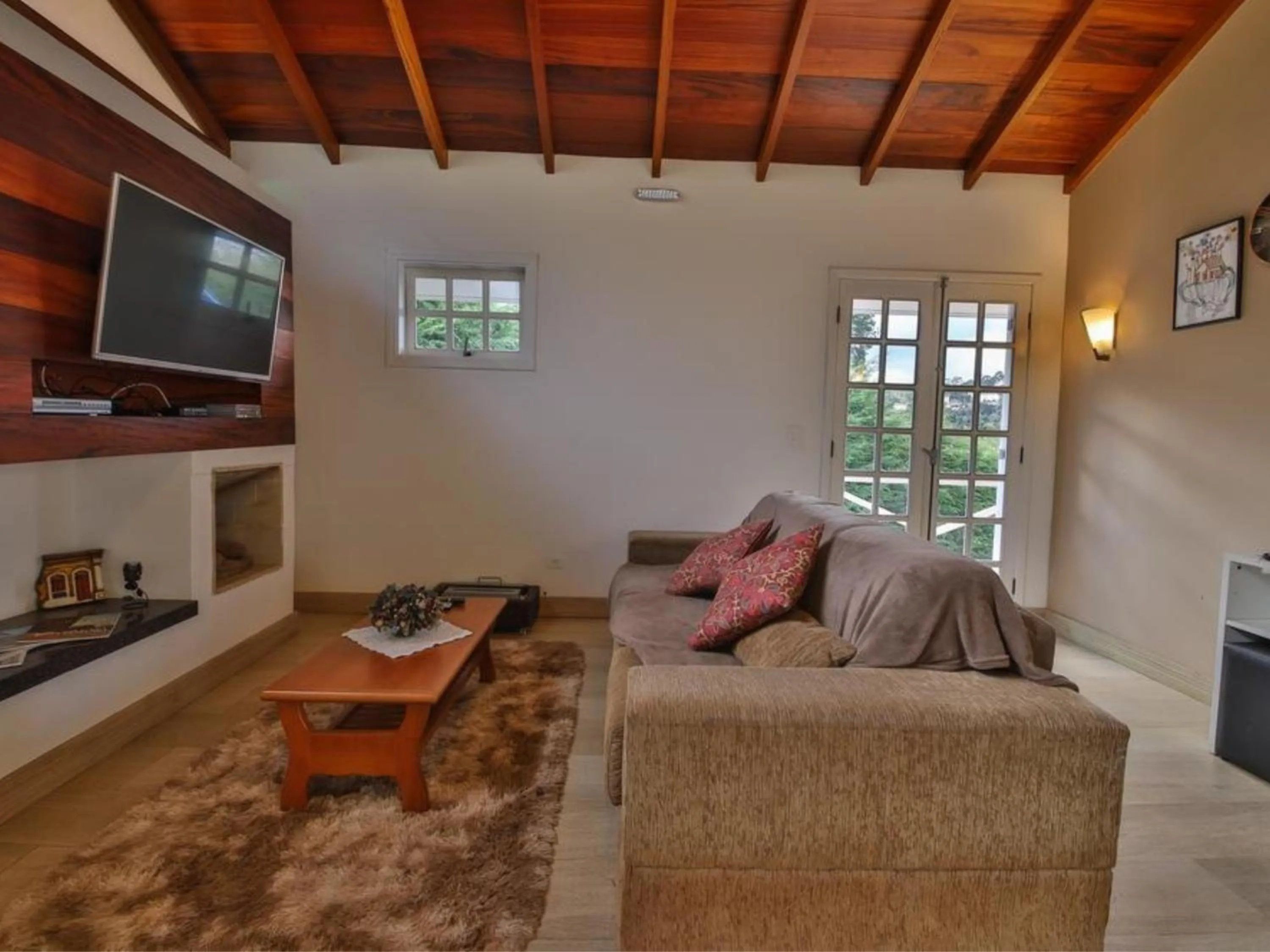 Communal lounge/ TV room in La Vita Pousada de Charme