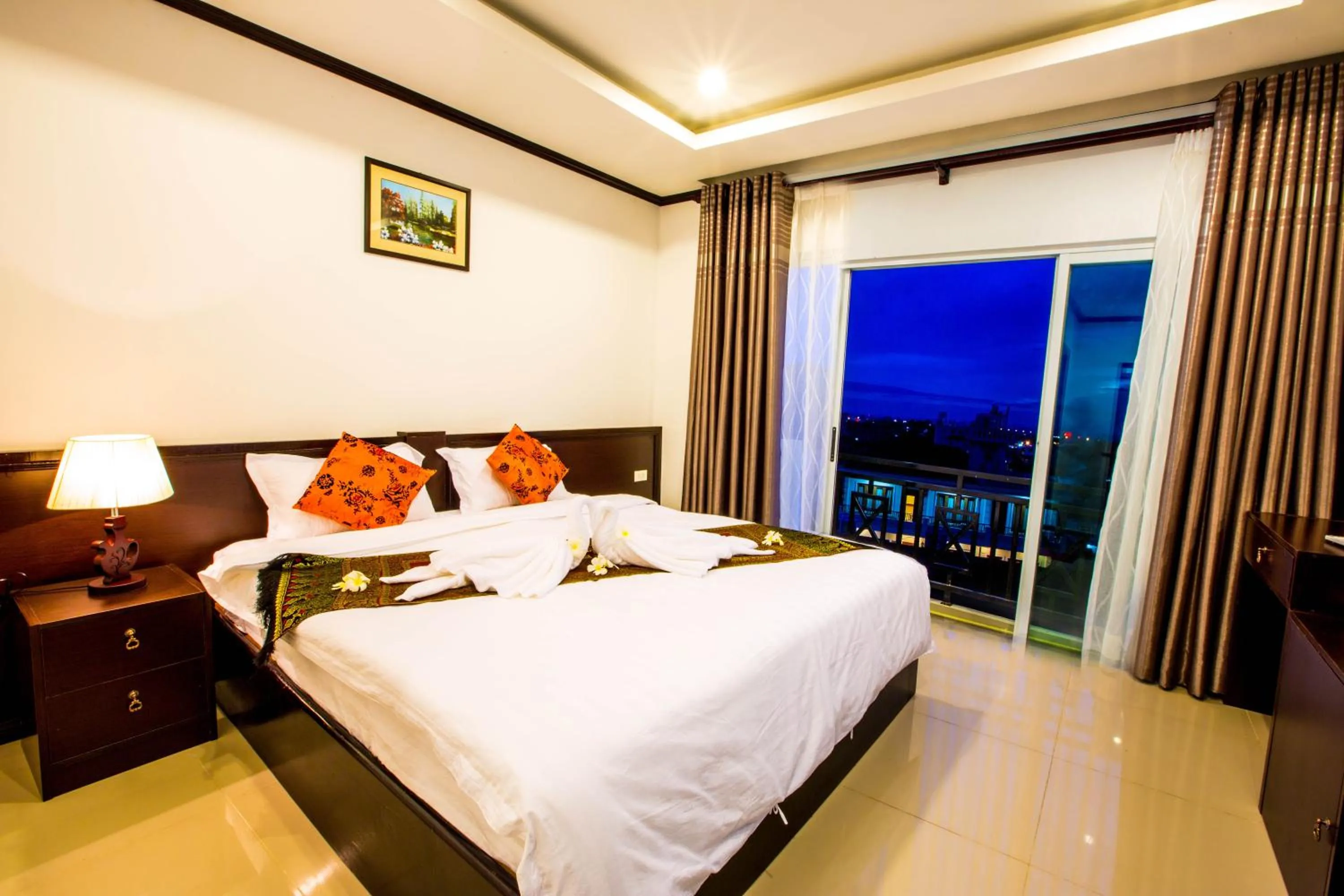 Bed in Douangchan Plaza Hotel