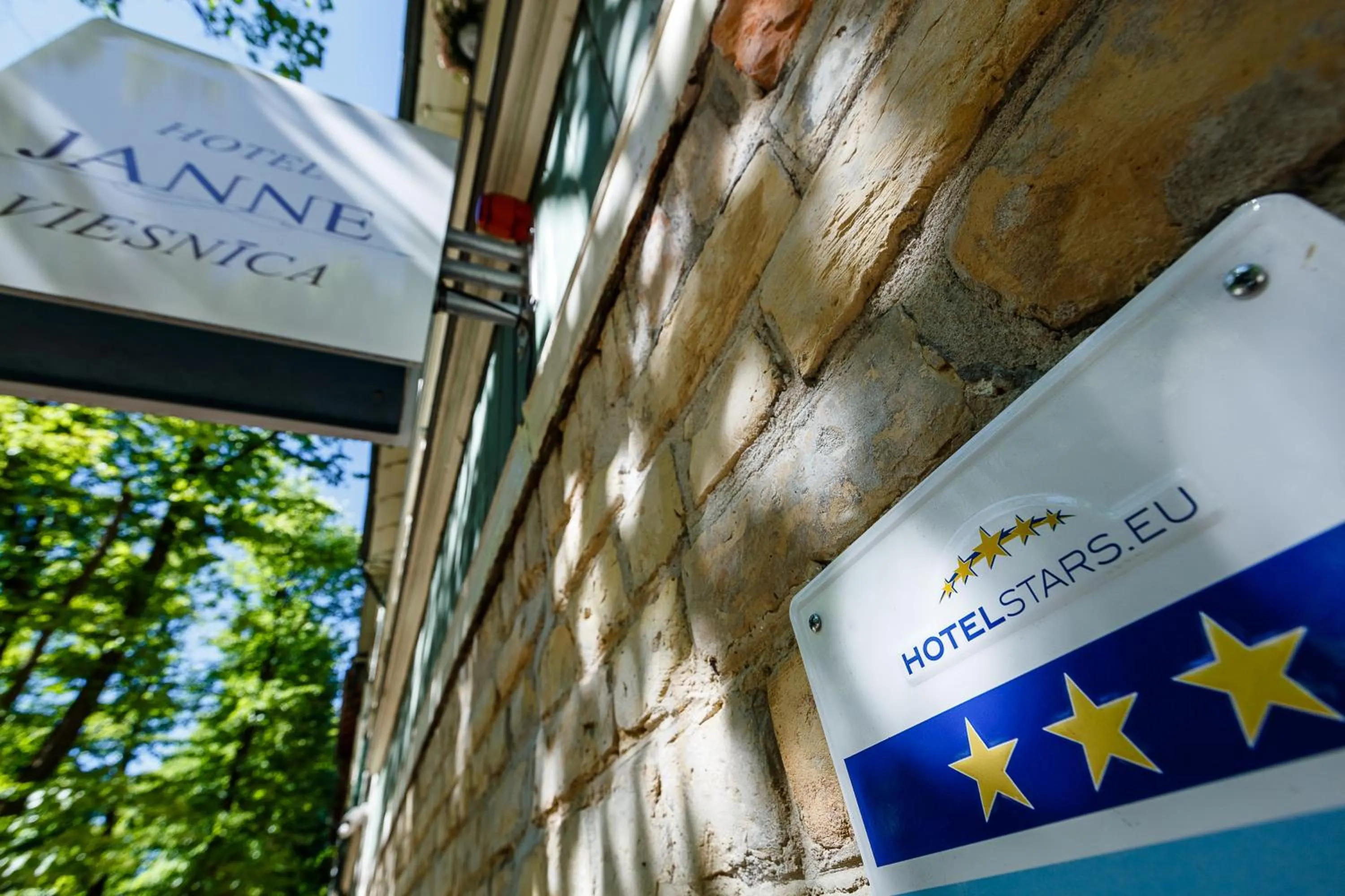 Property logo or sign in Janne Hotel with Self Check-in