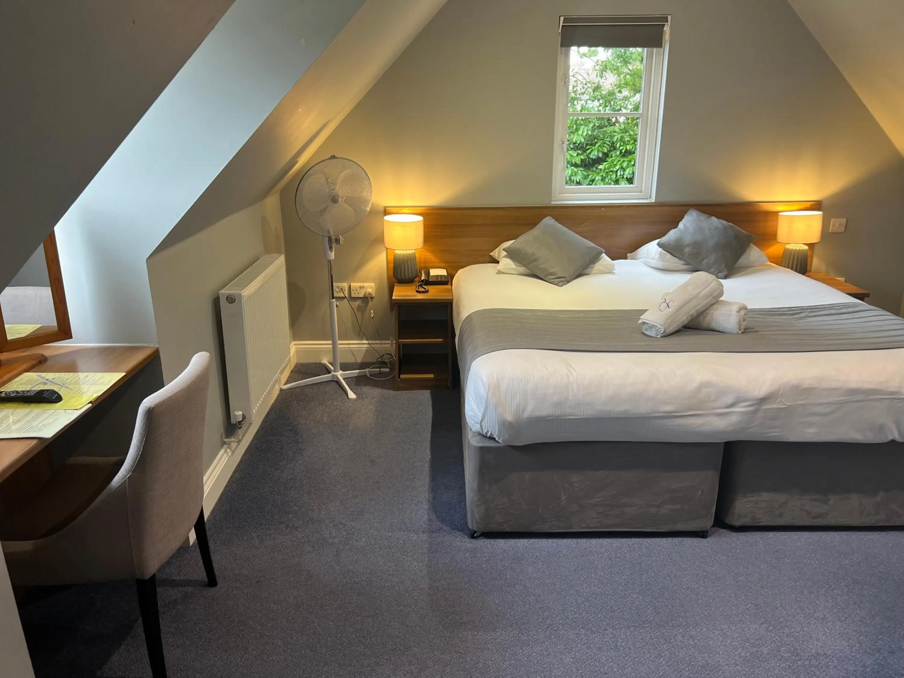 Bed in Corner House Hotel Gatwick with bookable Holiday parking