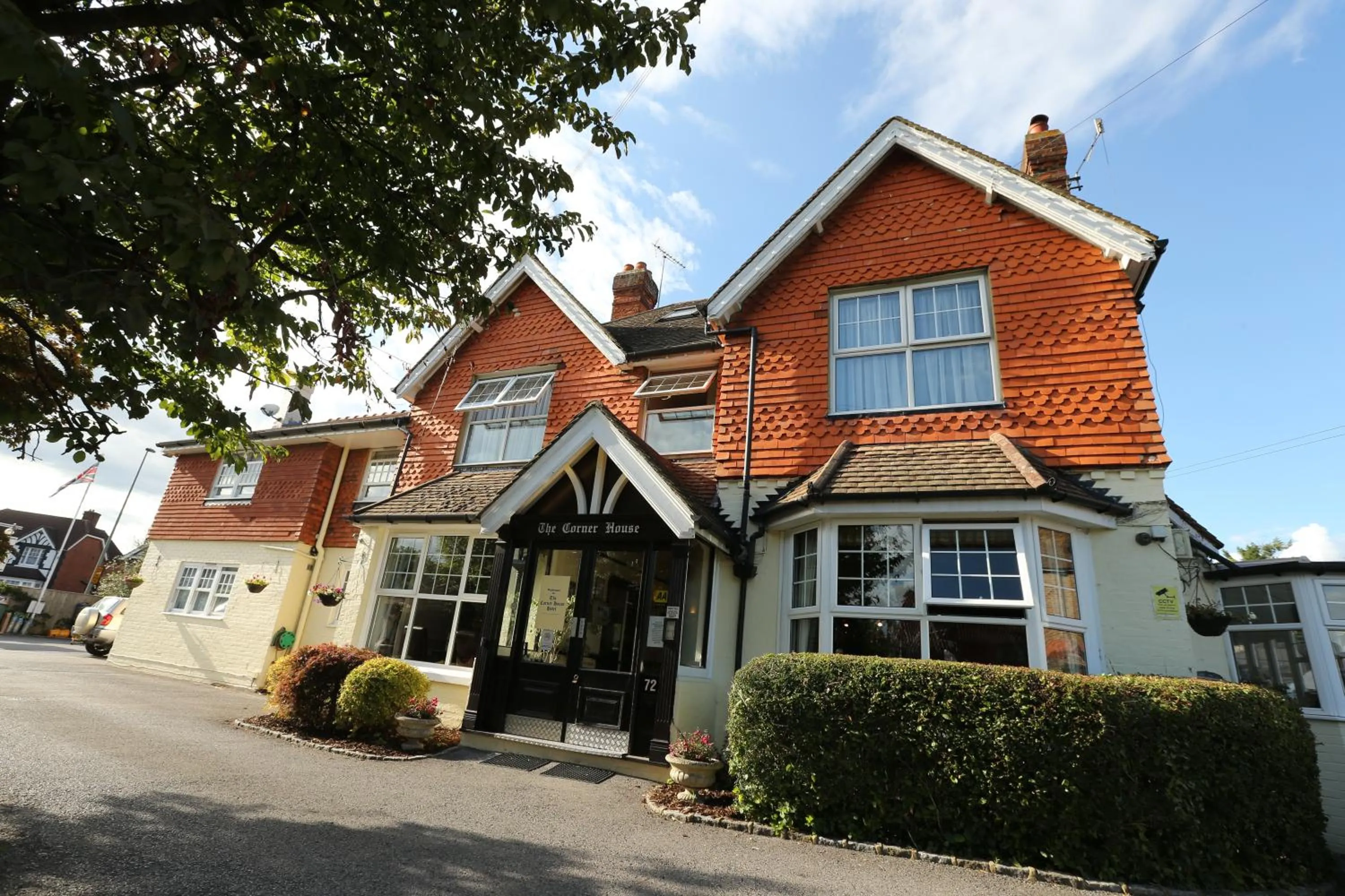Property building in Corner House Hotel Gatwick with bookable Holiday parking