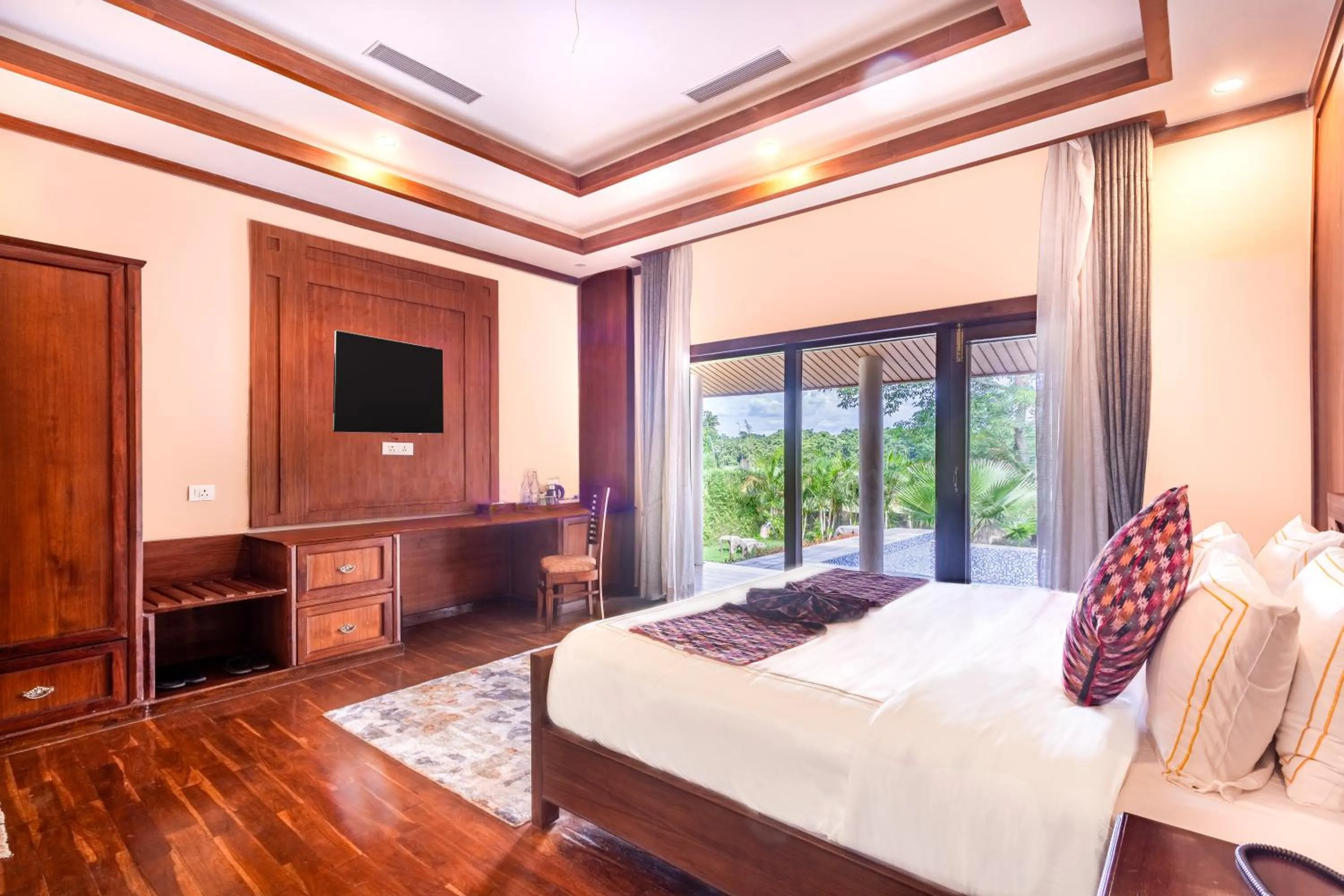 Bed in River Bank Jungle Resort, Chitwan