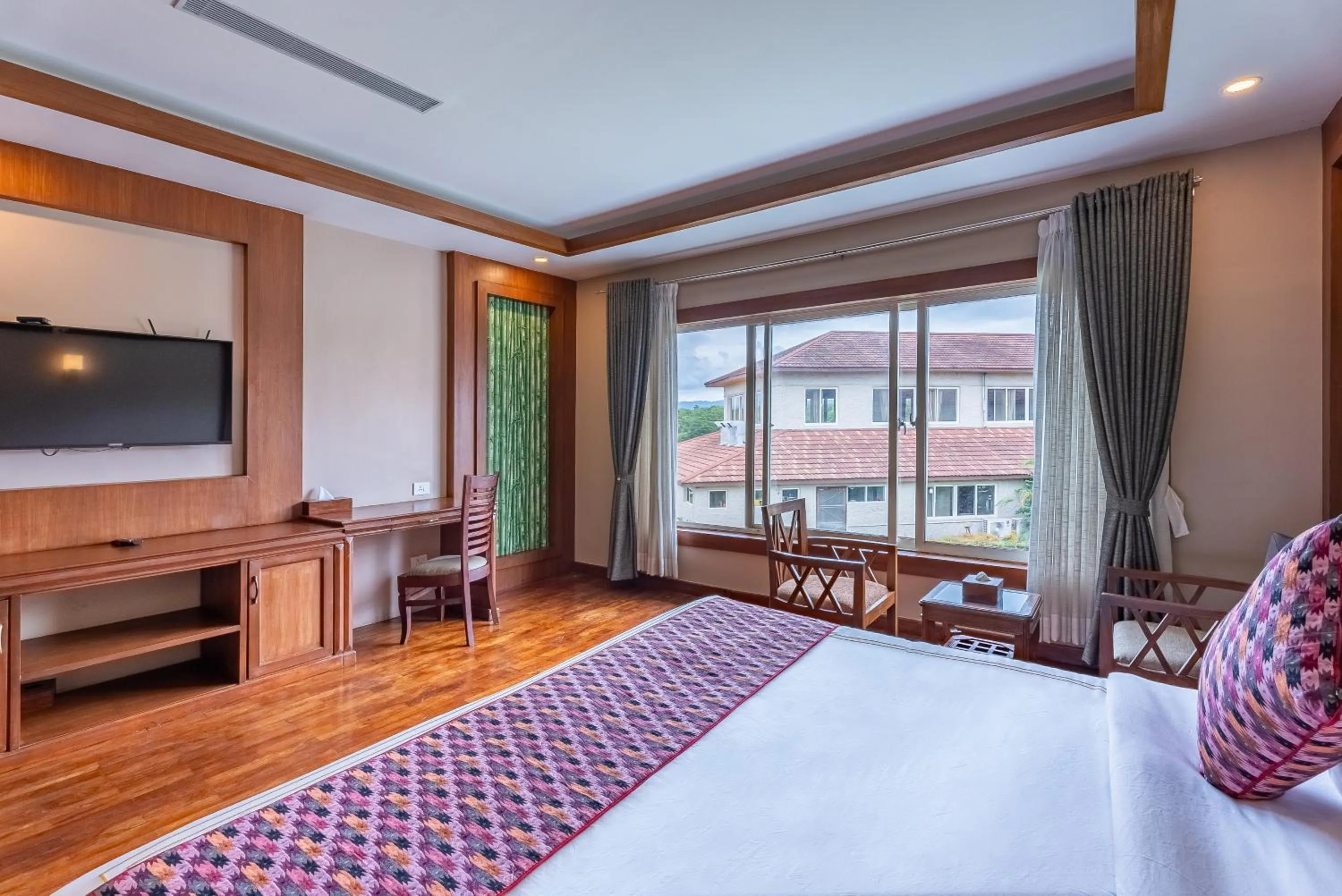 Bed in River Bank Jungle Resort, Chitwan