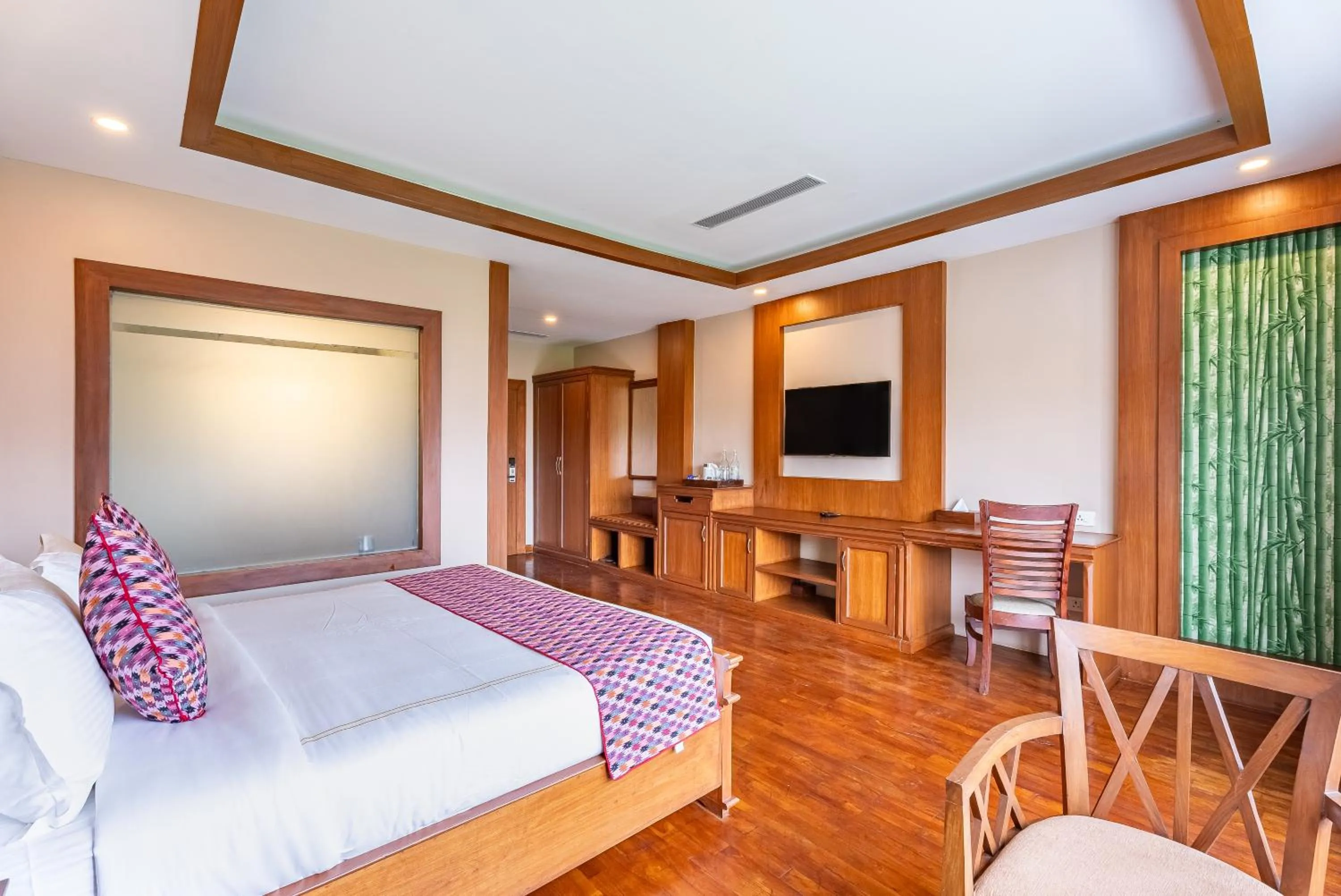 Bed in River Bank Jungle Resort, Chitwan