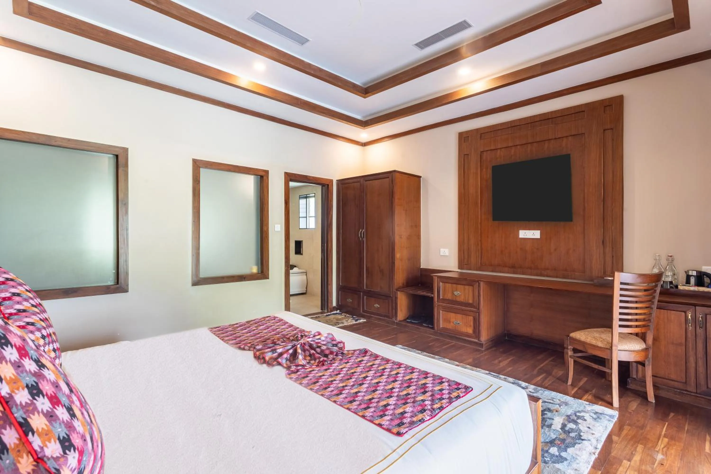 Bed in River Bank Jungle Resort, Chitwan