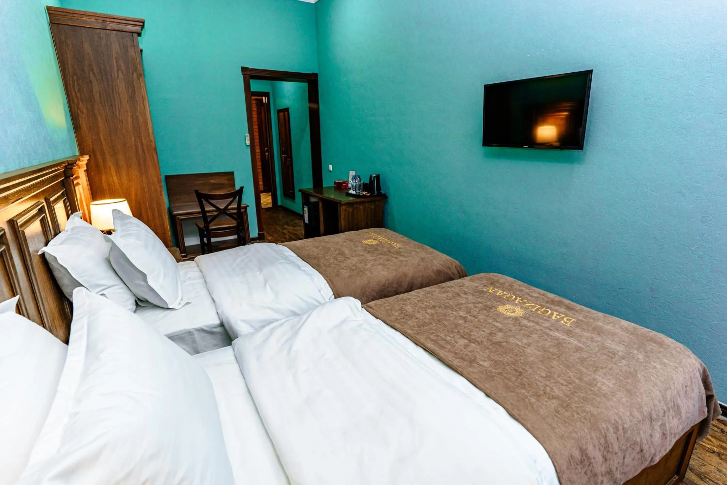 Communal lounge/ TV room, Bed in Bagizagan Hotel