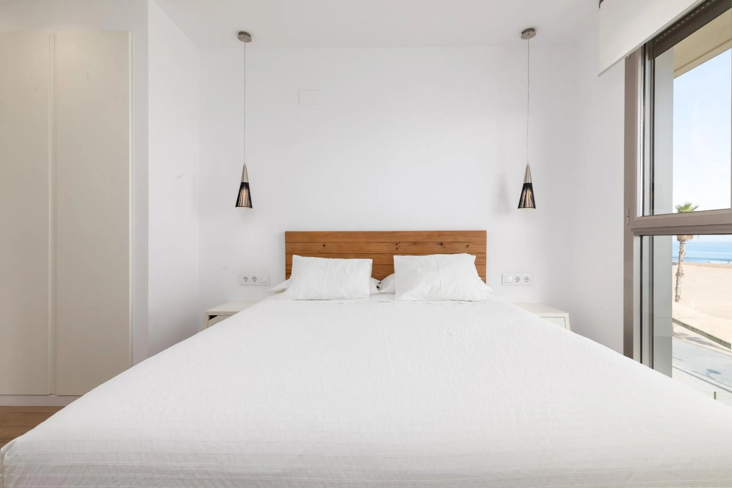 Bed in ApartUP Patacona Deluxe