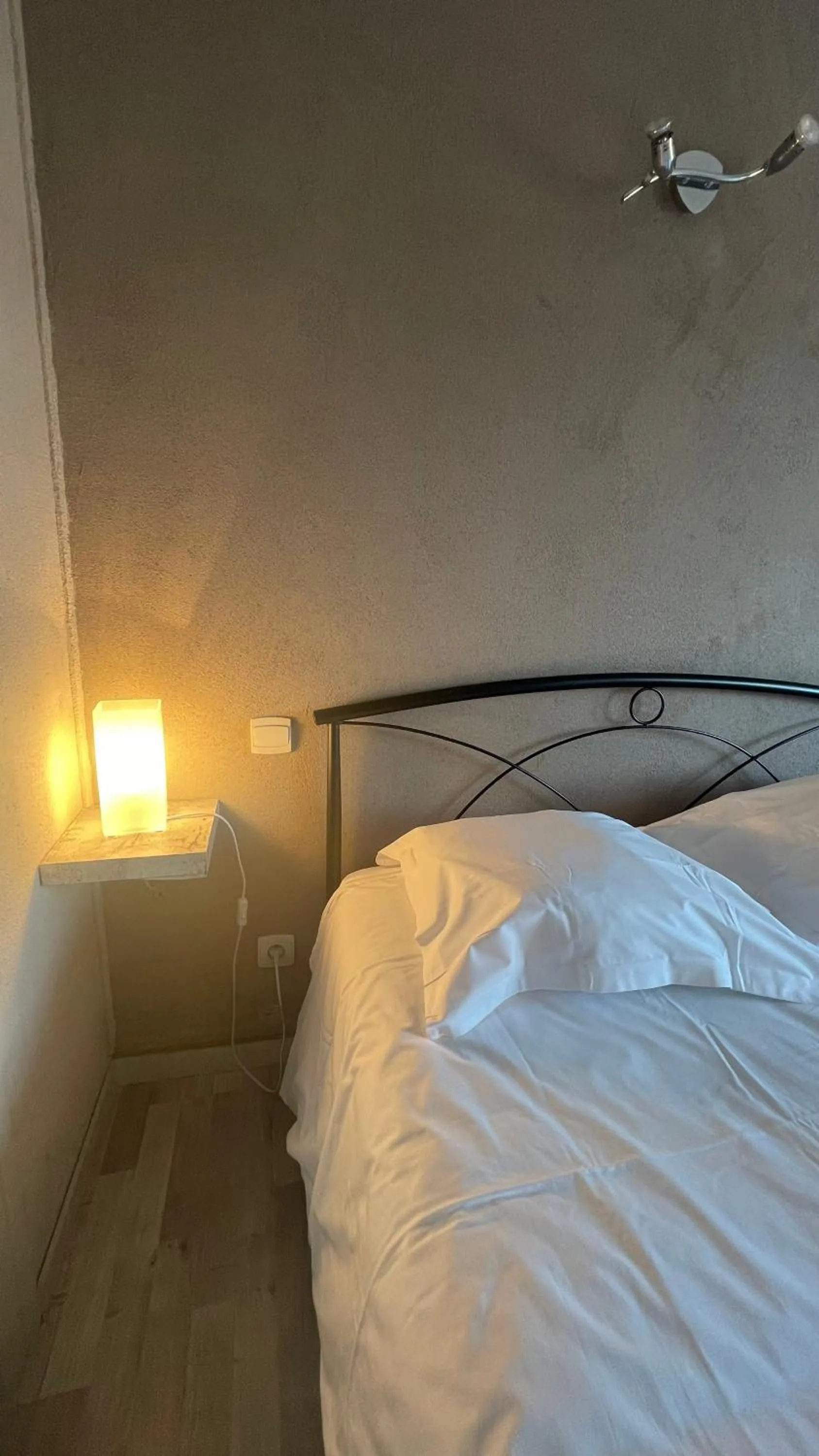 Bed in L'Excess Hotel