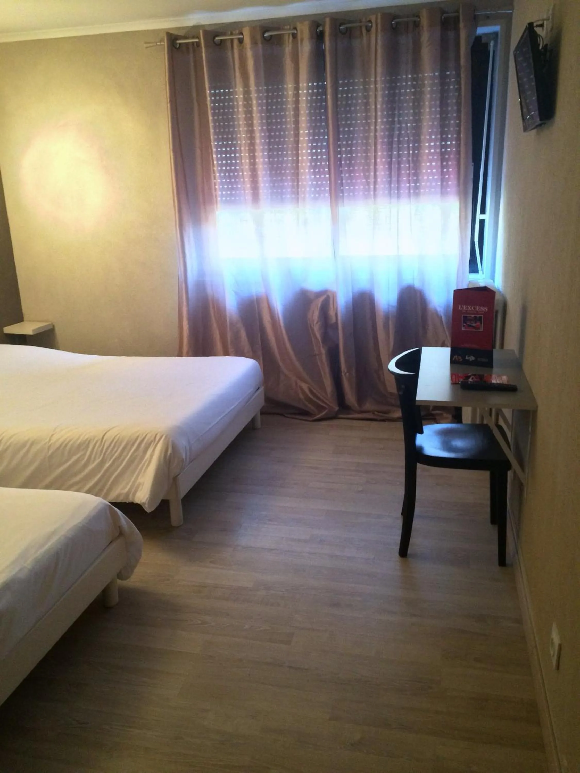 Bed in L'Excess Hotel