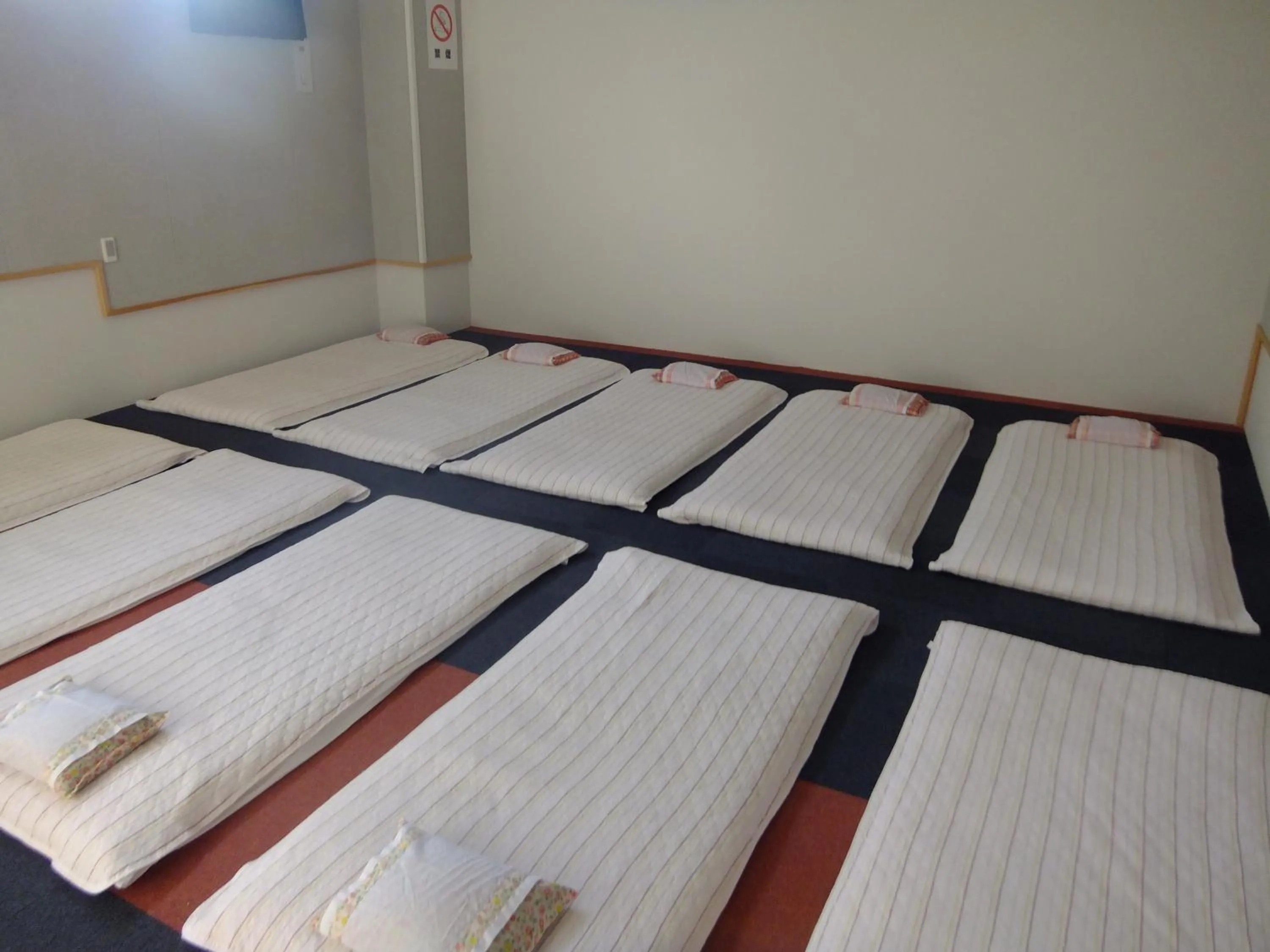 Bed in Natural Onsen Hostel Hidamari no Yu