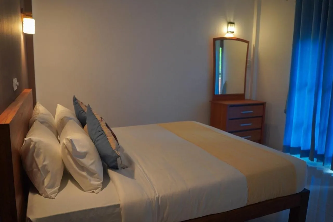 Bed in Sigiriya Cottage