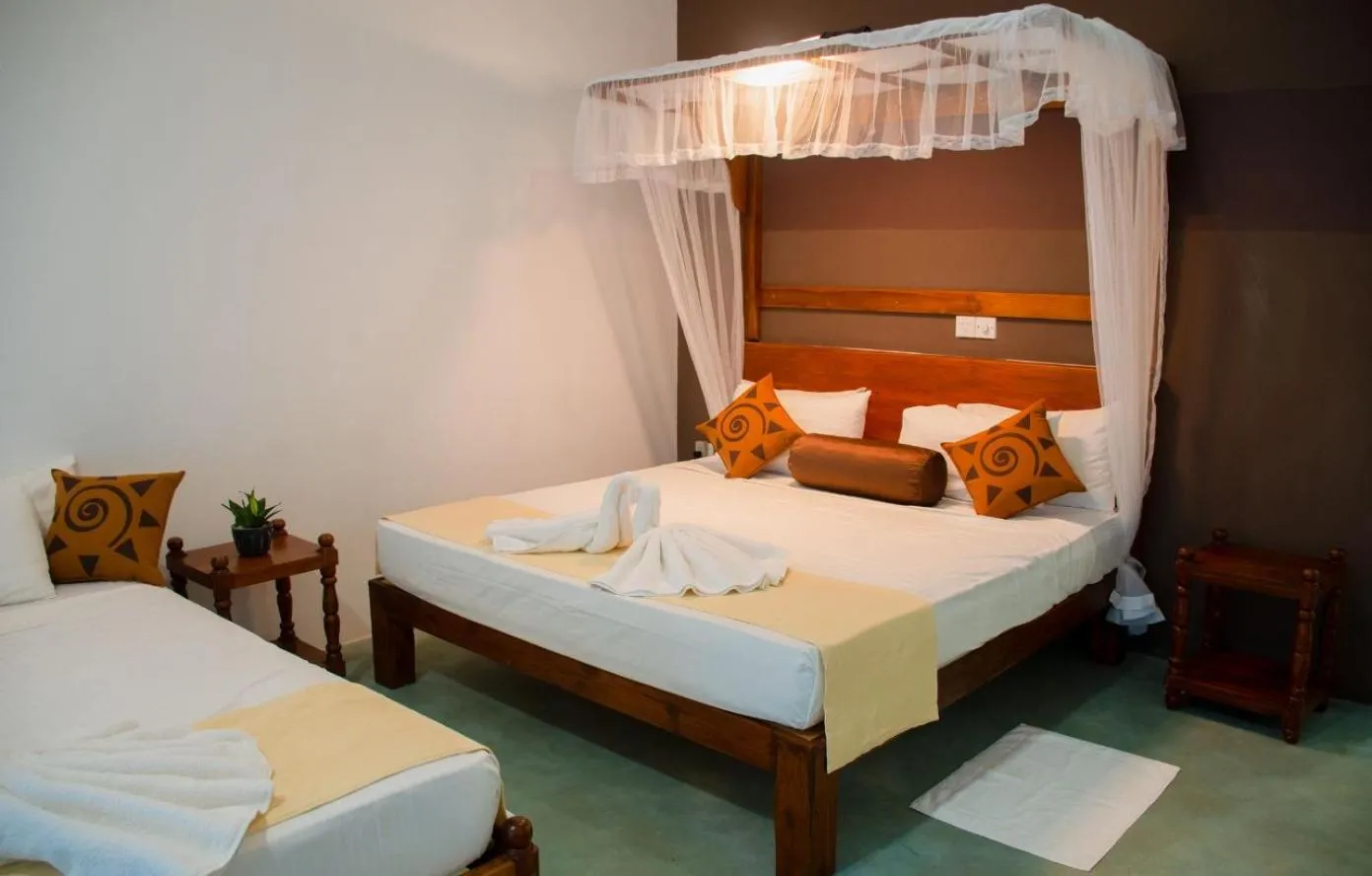 Bed in Sigiriya Cottage