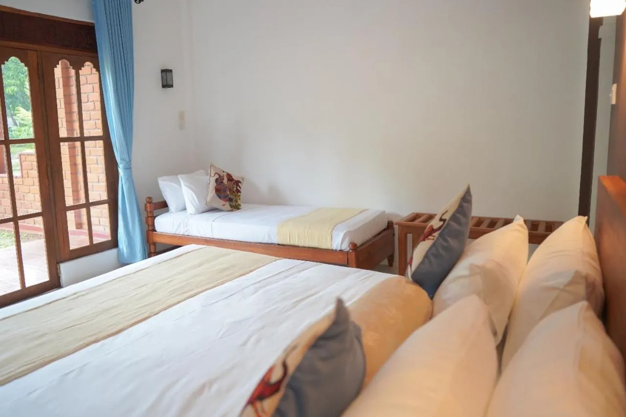 Bed in Sigiriya Cottage