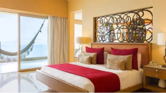 Bed in GARZA BLANCA PRESERVE RESORT & SPA