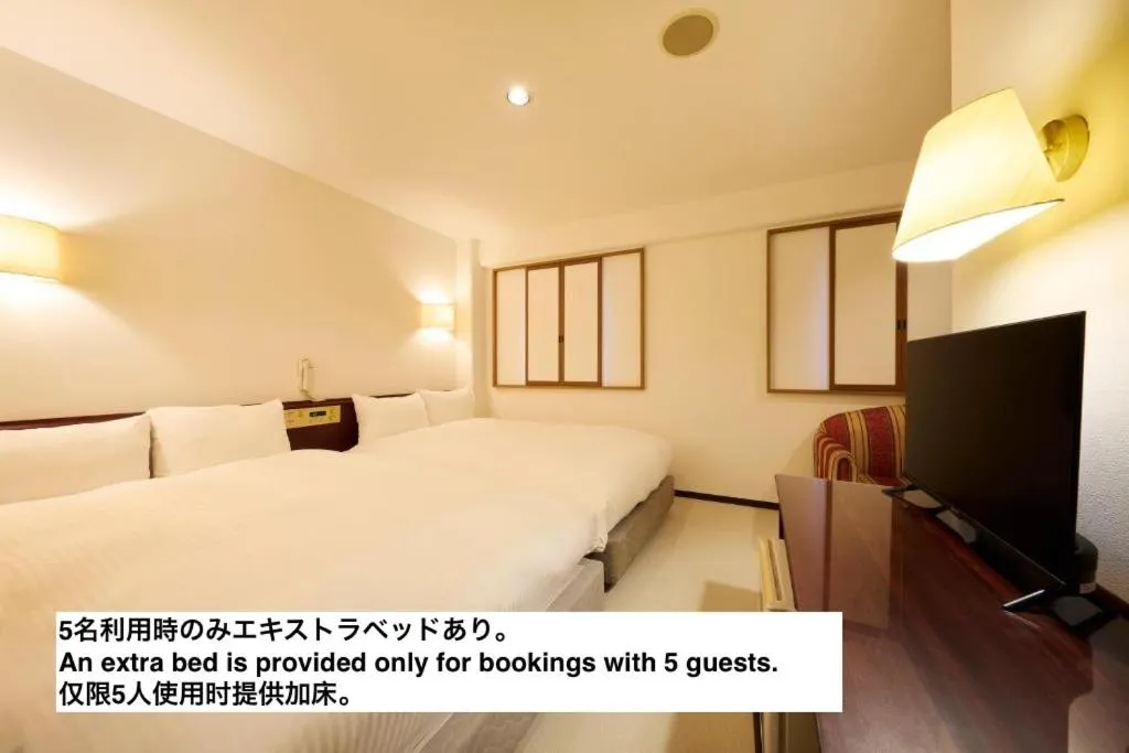 Bed in Centurion Hotel Hamamatsu