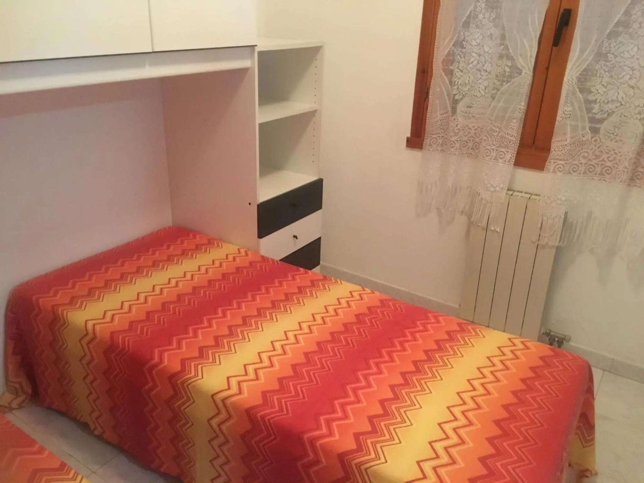 Bed in VILLAGGIO ANDORA COLOMBO