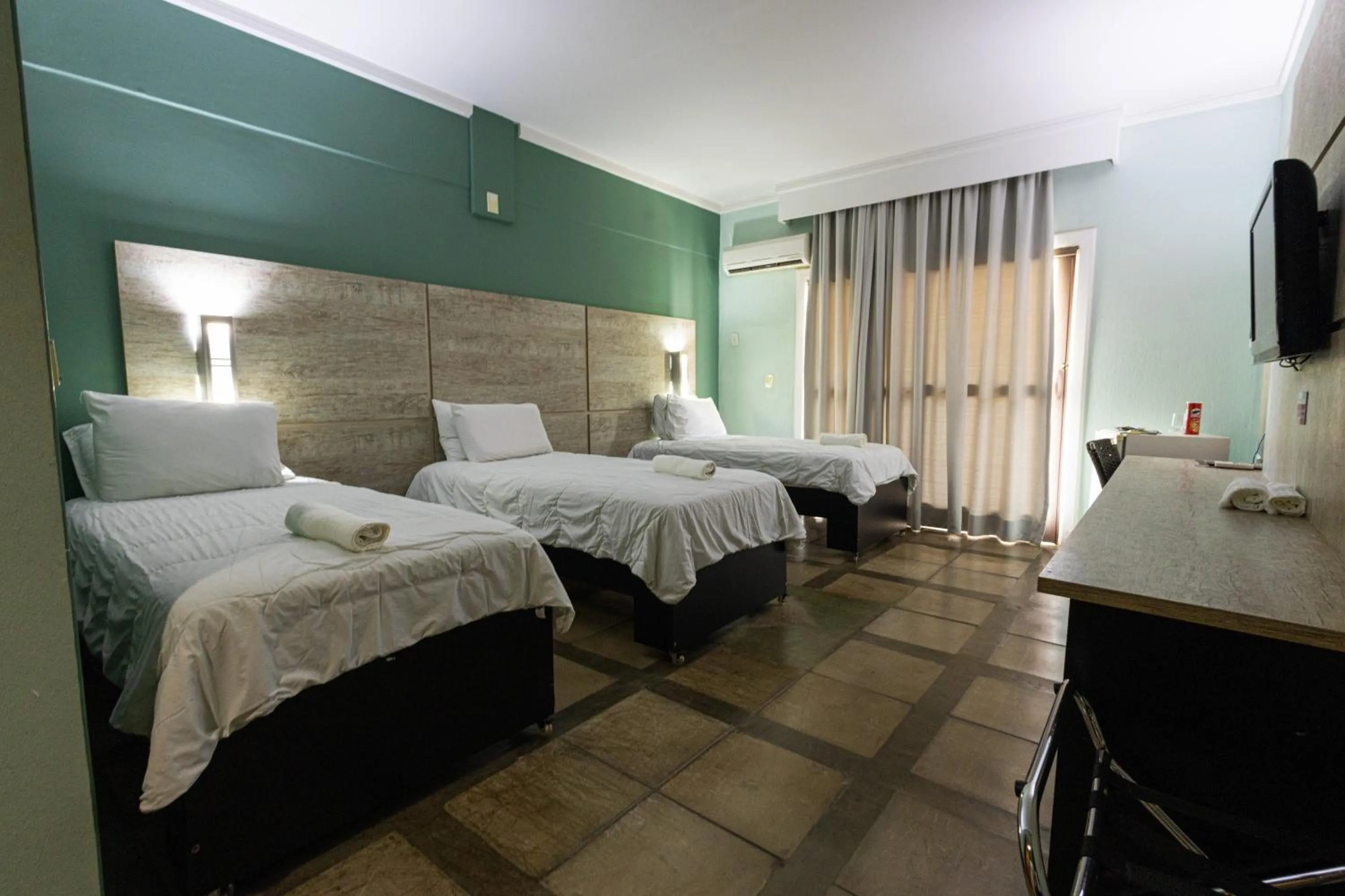 Bed in ARAGUAIA HOTEL