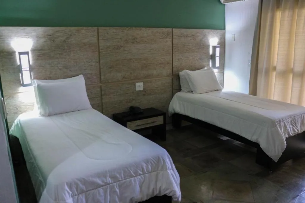 Bed in ARAGUAIA HOTEL