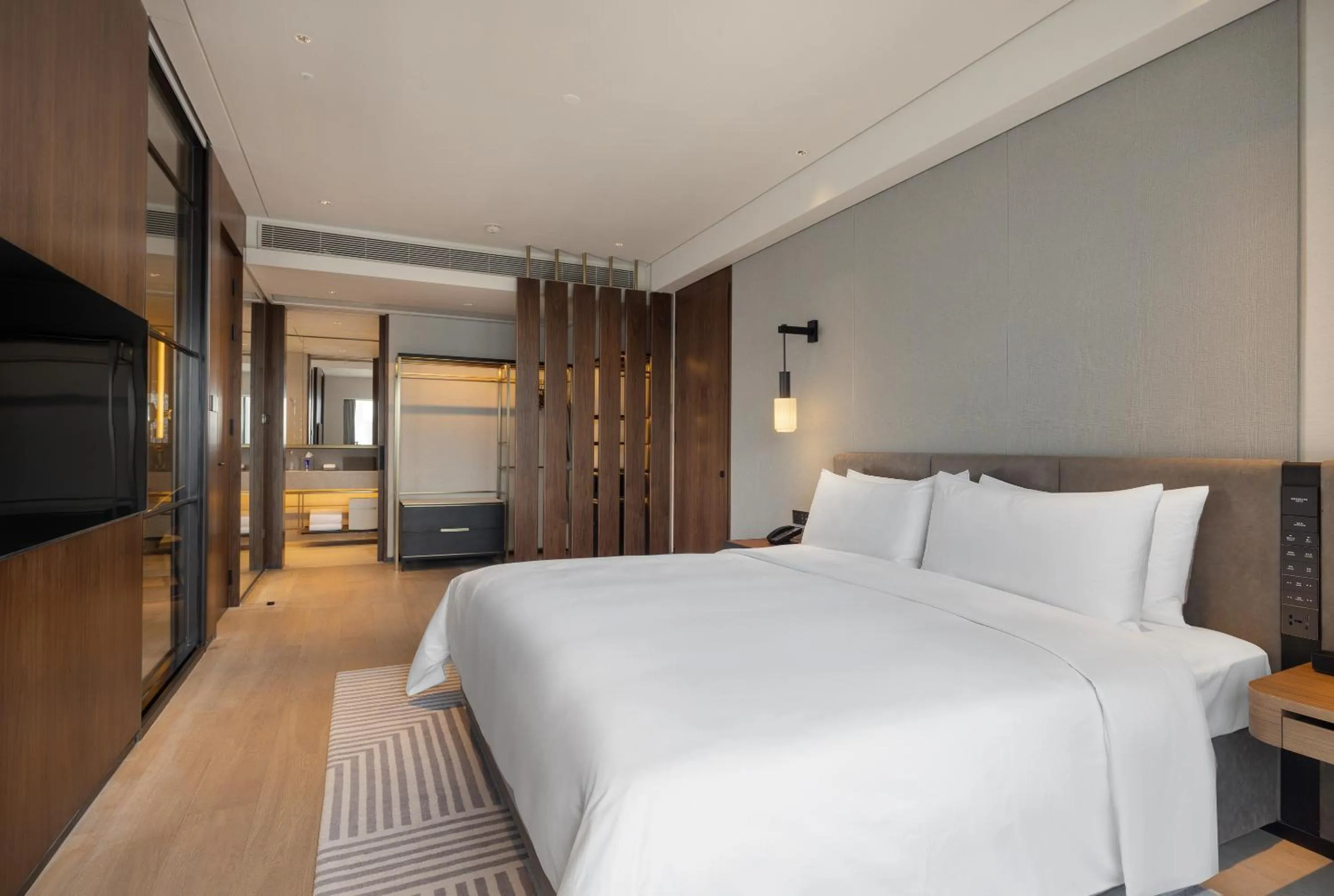 Bed in New World Guangzhou Hotel