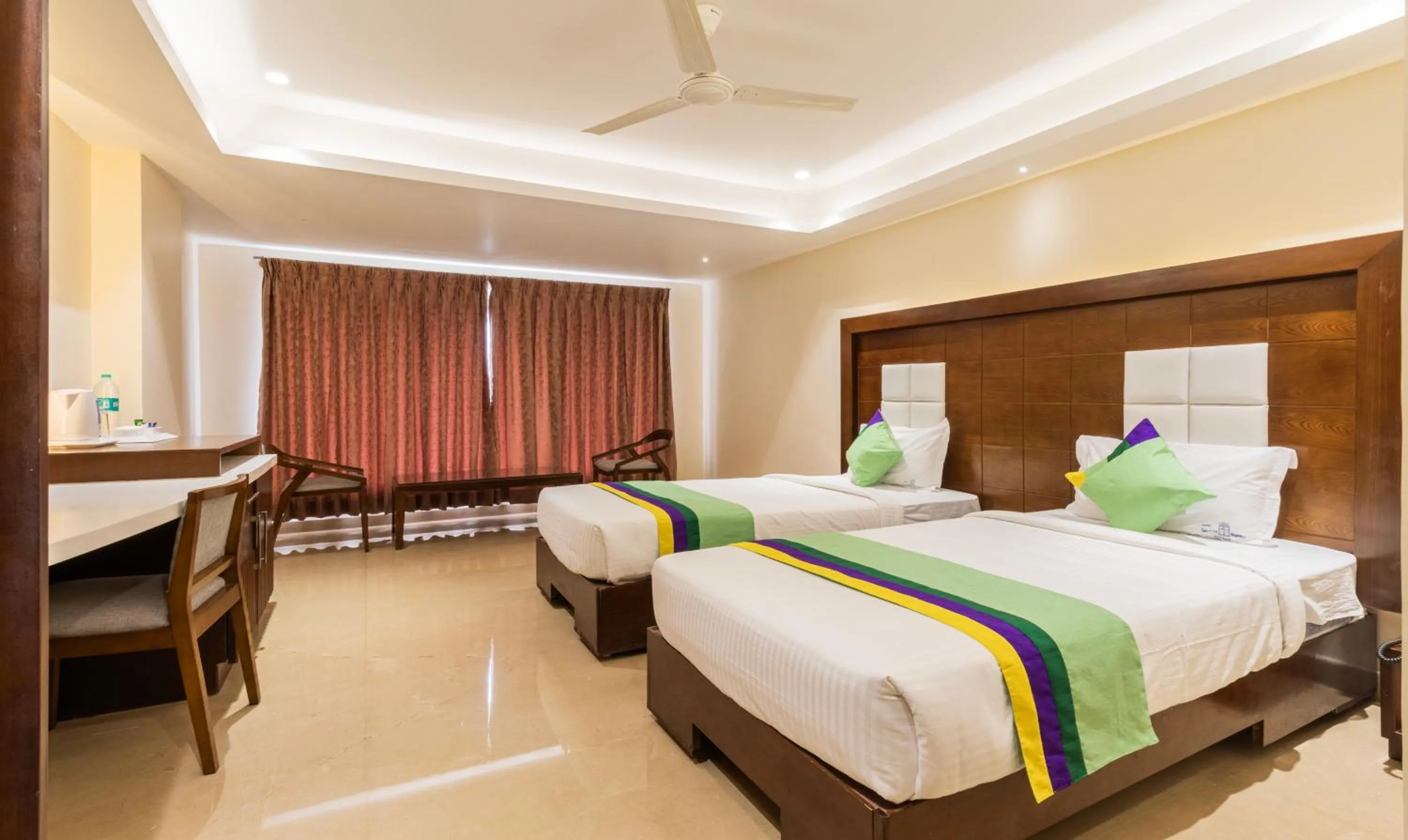 Bedroom, Bed in Treebo Suvarna Comforts