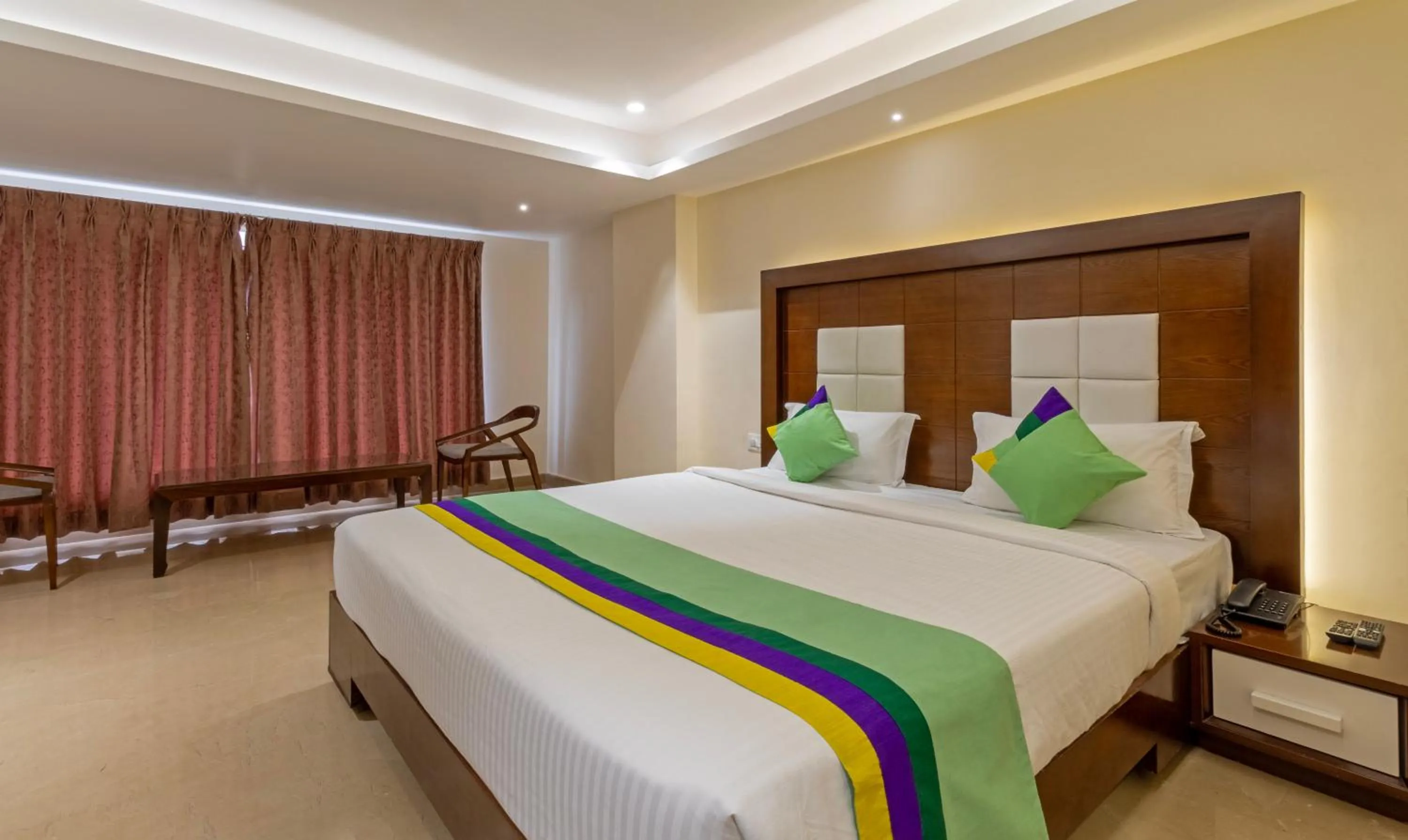 Bed in Treebo Suvarna Comforts