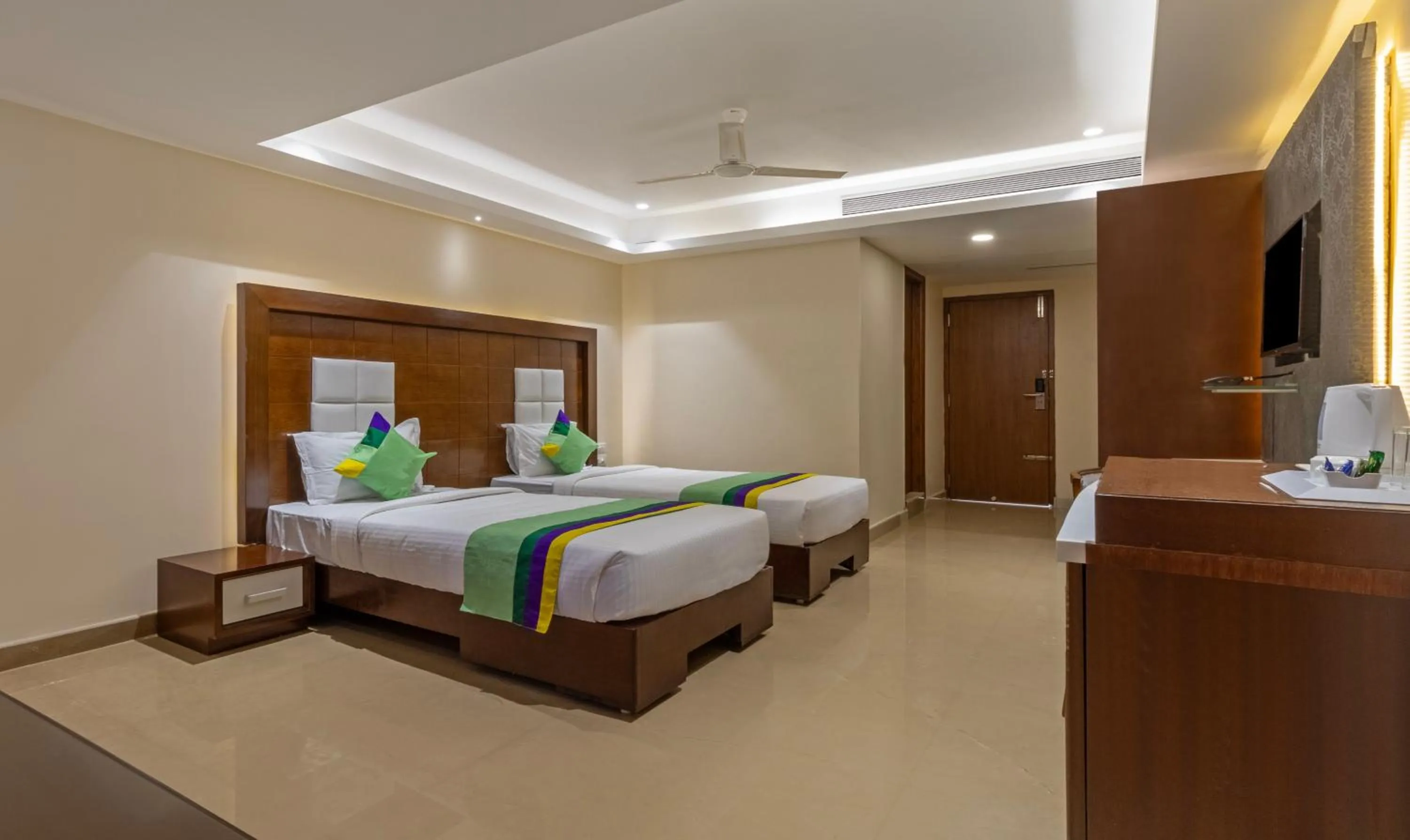 Bedroom, Bed in Treebo Suvarna Comforts