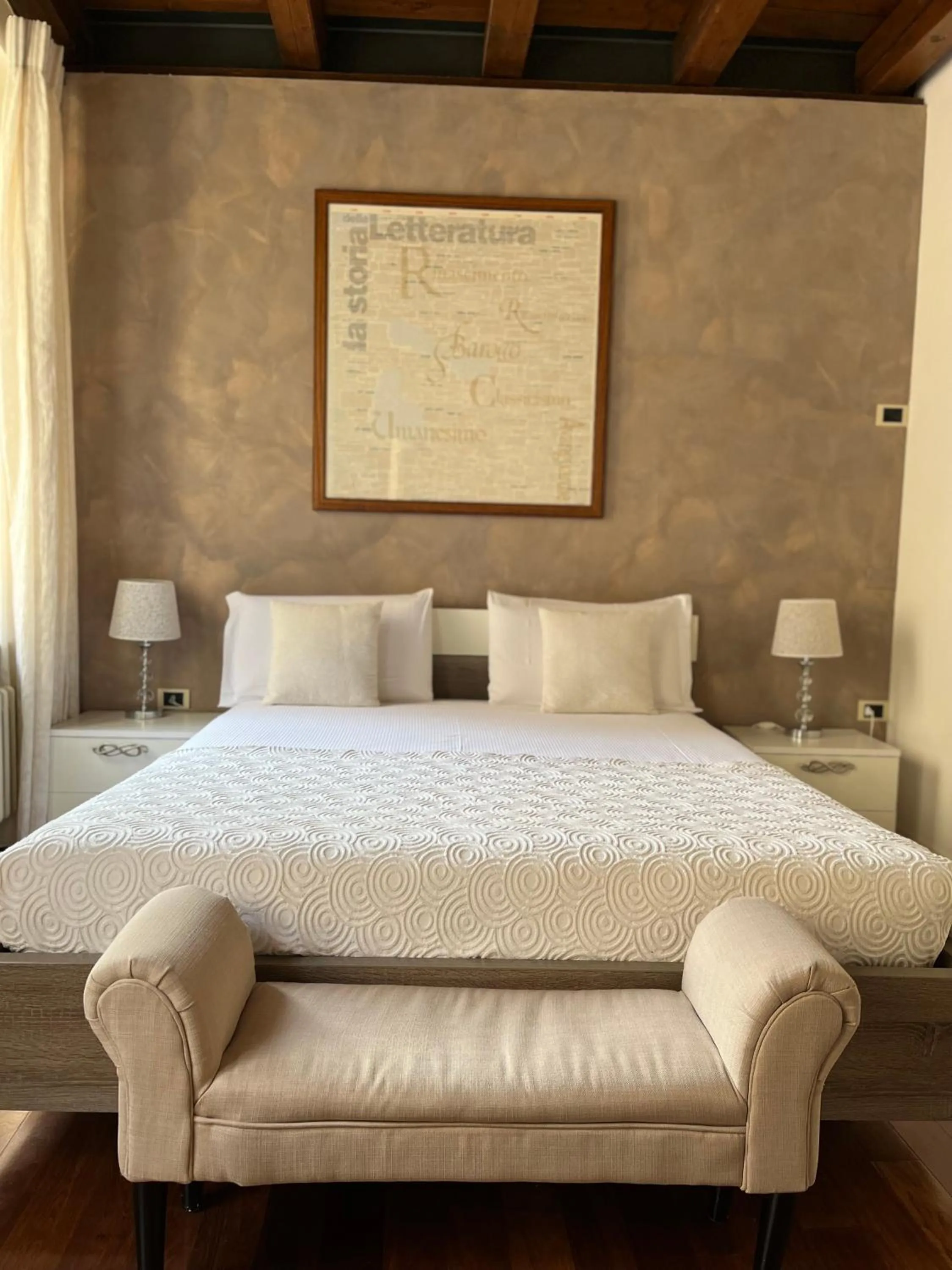 Bed in Relais Ponte Pietra