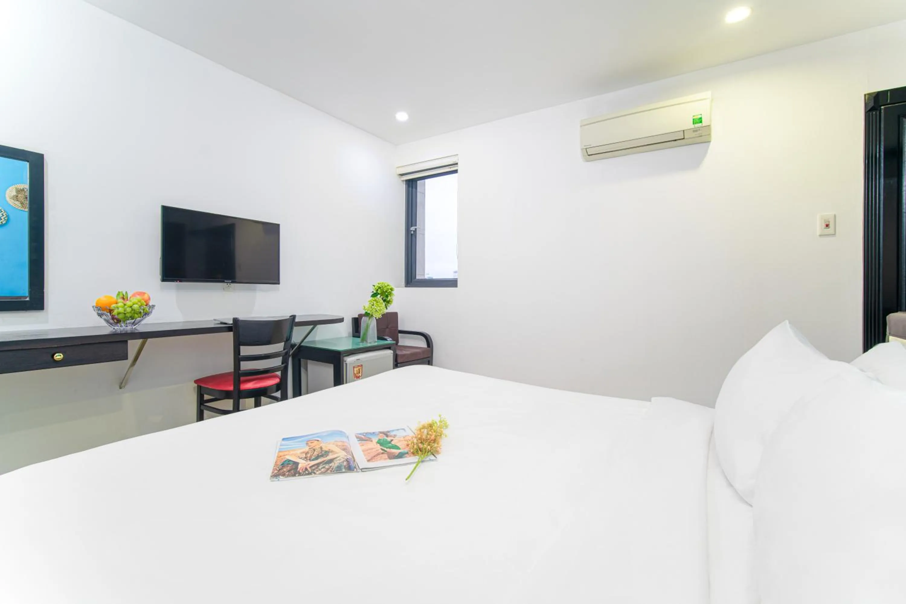 Communal lounge/ TV room in La Maison Danang Beach Hotel