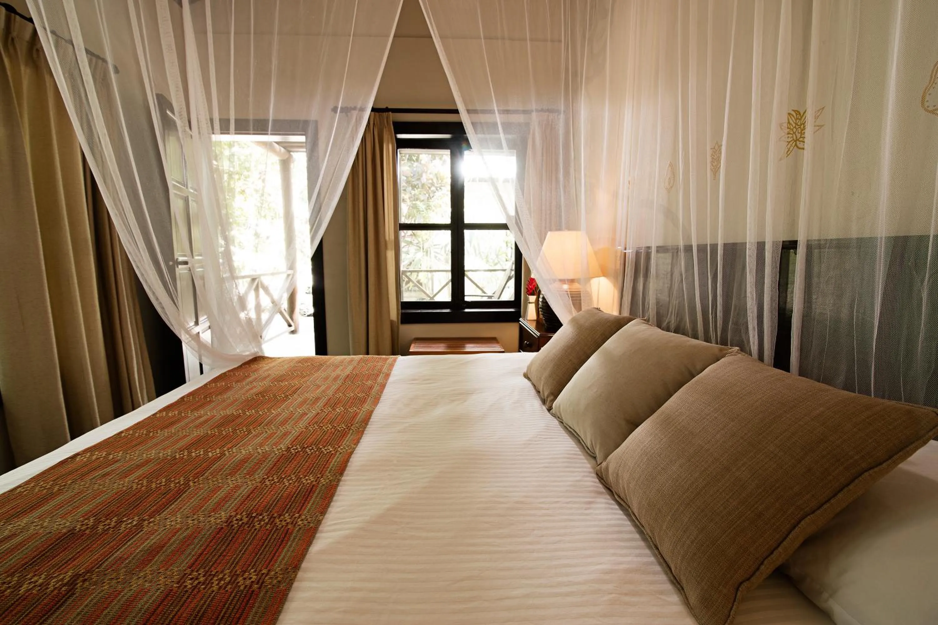 Bed in Hotel Jungle Lodge Tikal