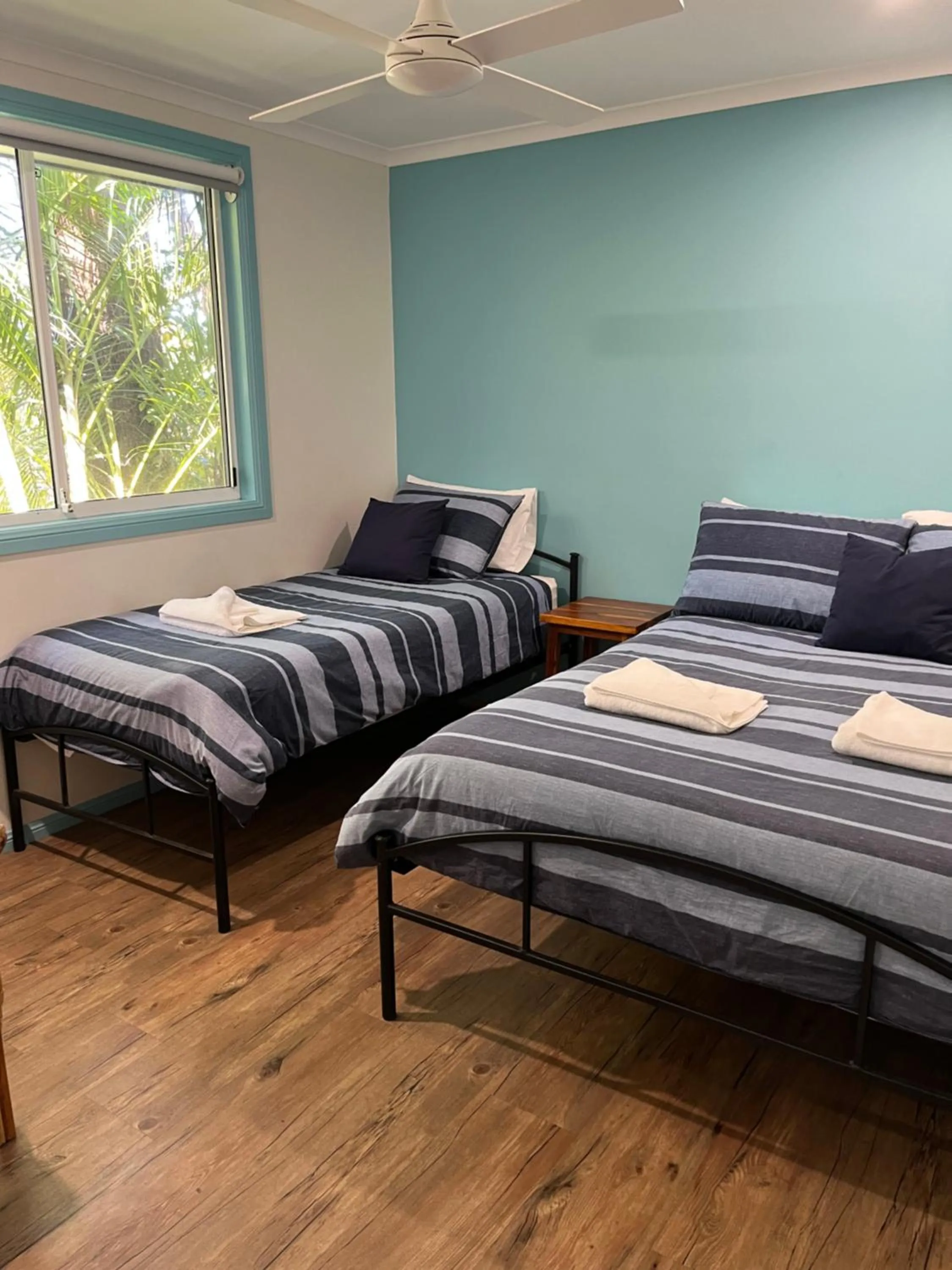 Bed in Safety Beach Bungalows