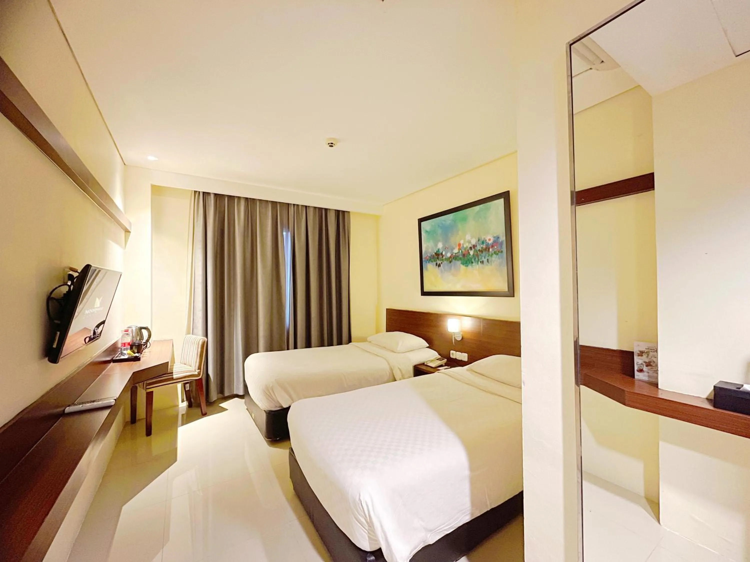 Bed in Noormans Hotel Semarang