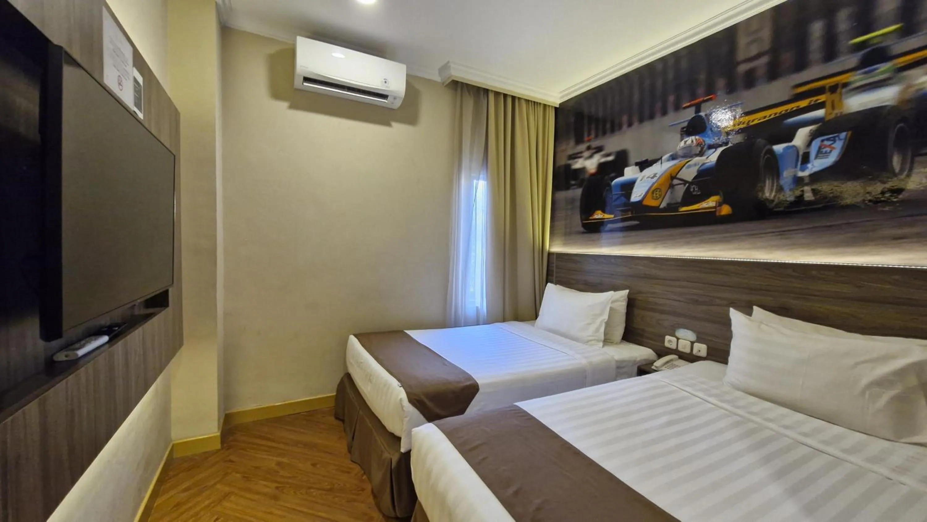 Bed in Lorin Syariah Hotel Sentul