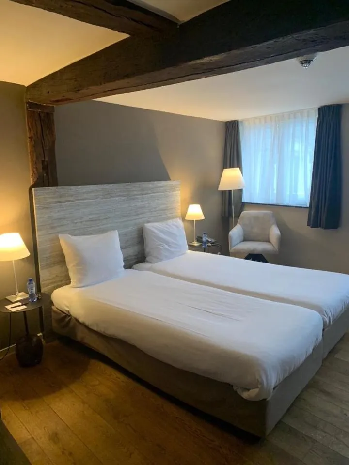 Bed in Hotel Au Quartier