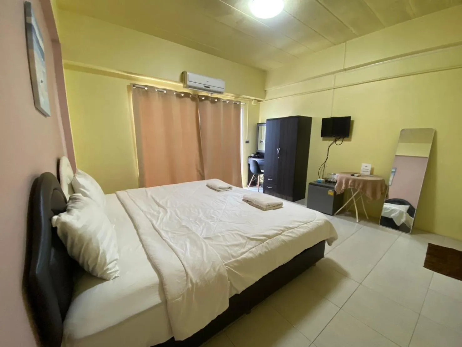 Bed in Grand Bangsaen Hotel