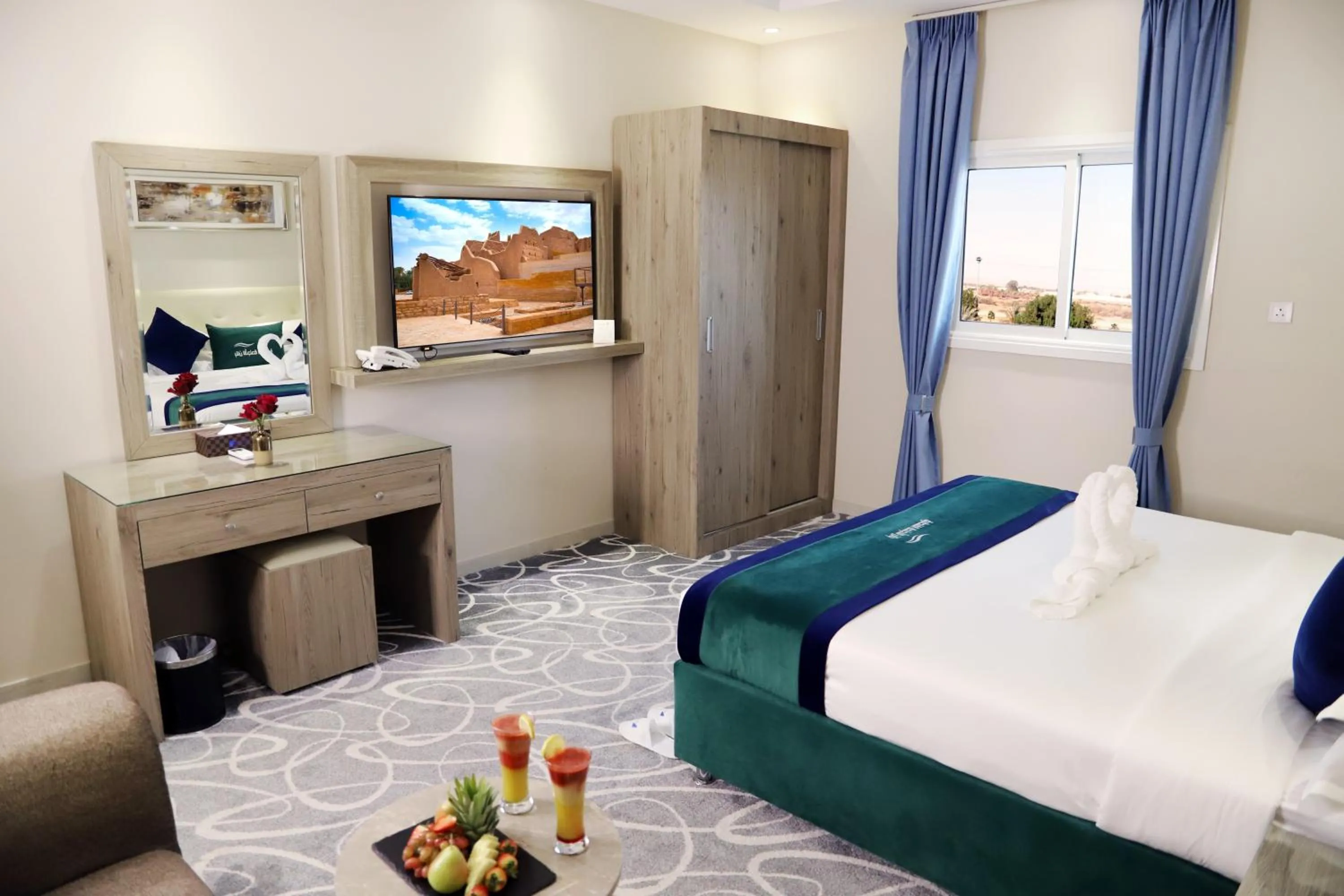 Bed in Sunrise Suites