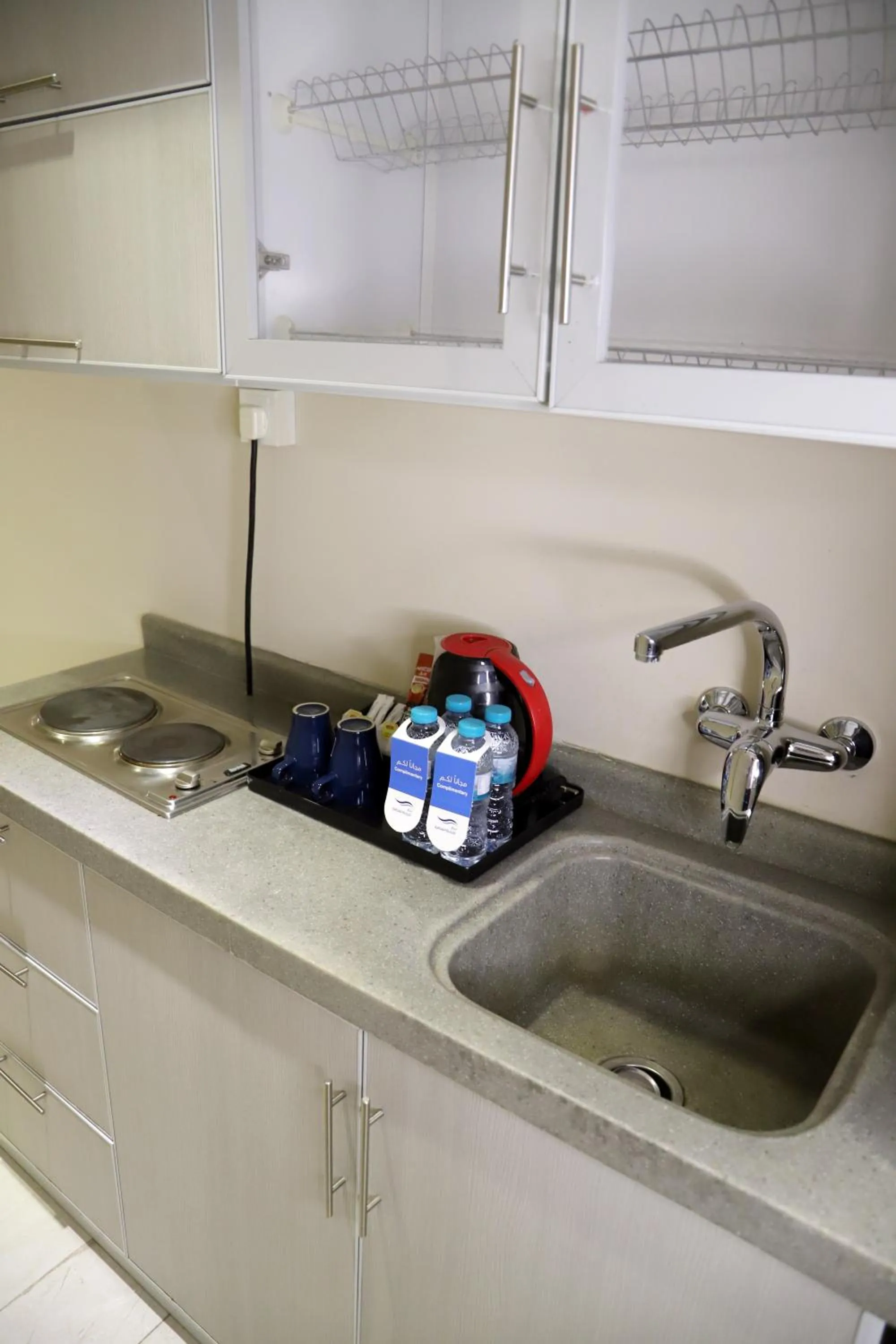 Kitchen or kitchenette in Sunrise Suites