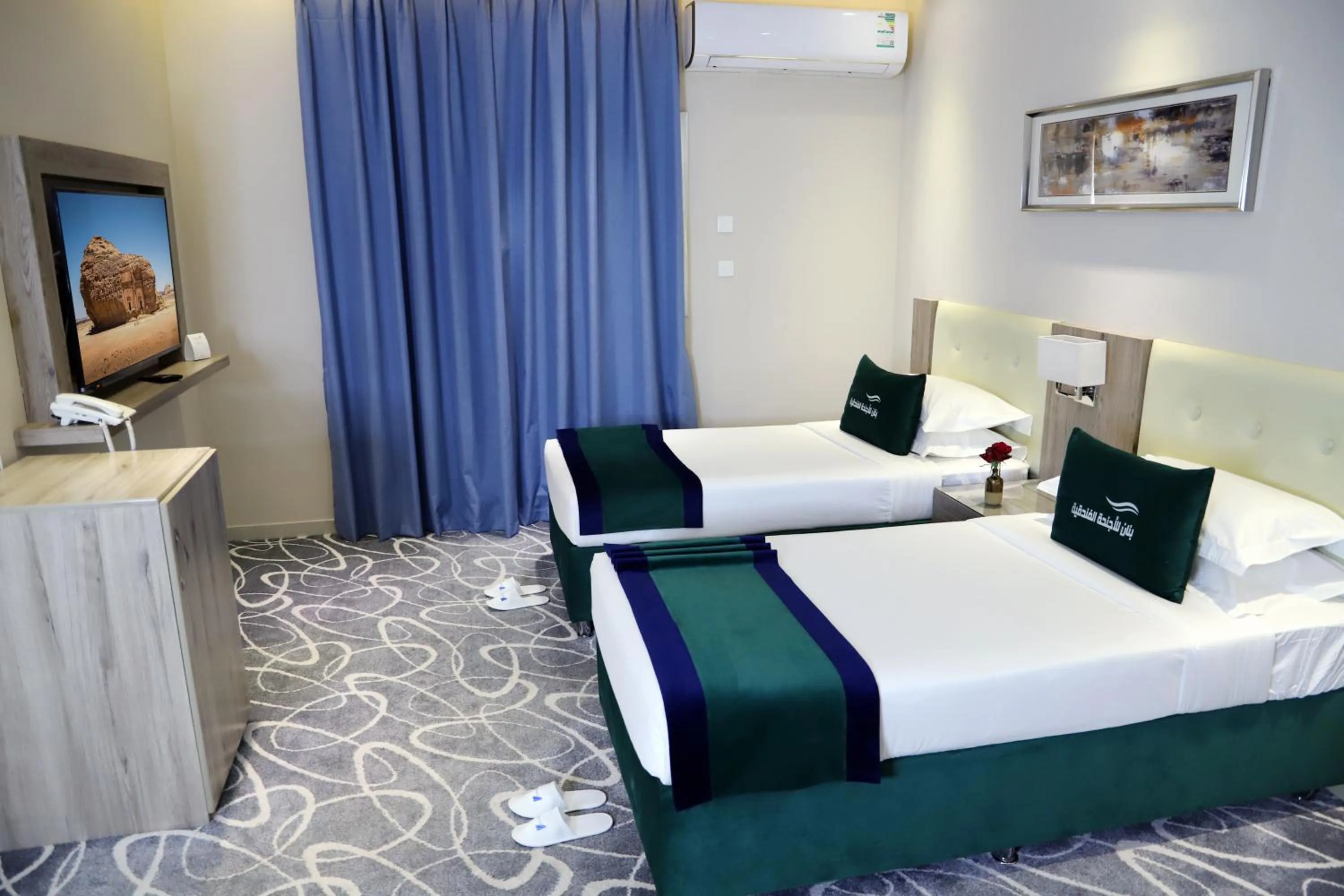 Bed in Sunrise Suites