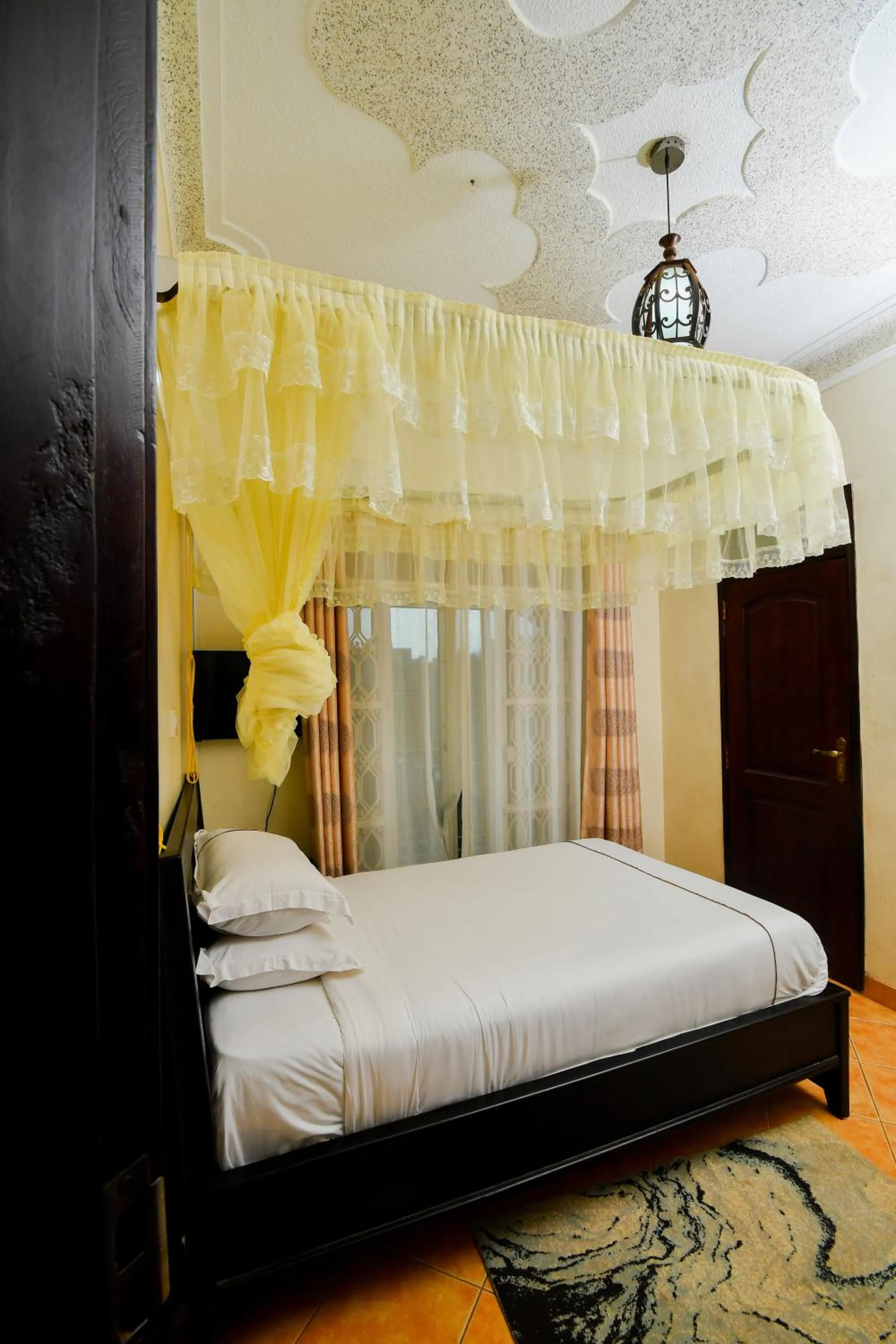 Bed in Fancy Hotel Munyonyo