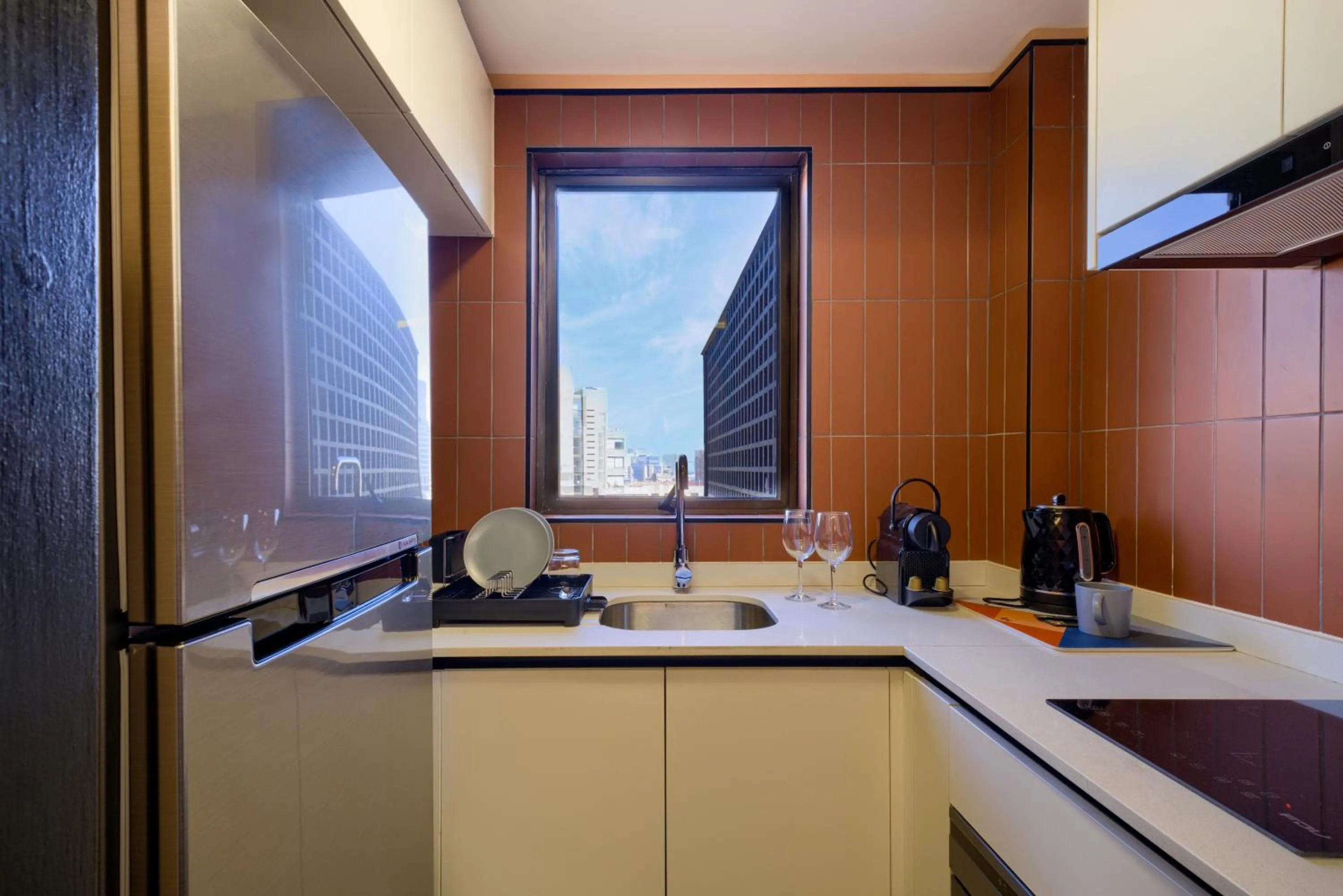 Kitchen or kitchenette in APT Serviced Apartments Santiago