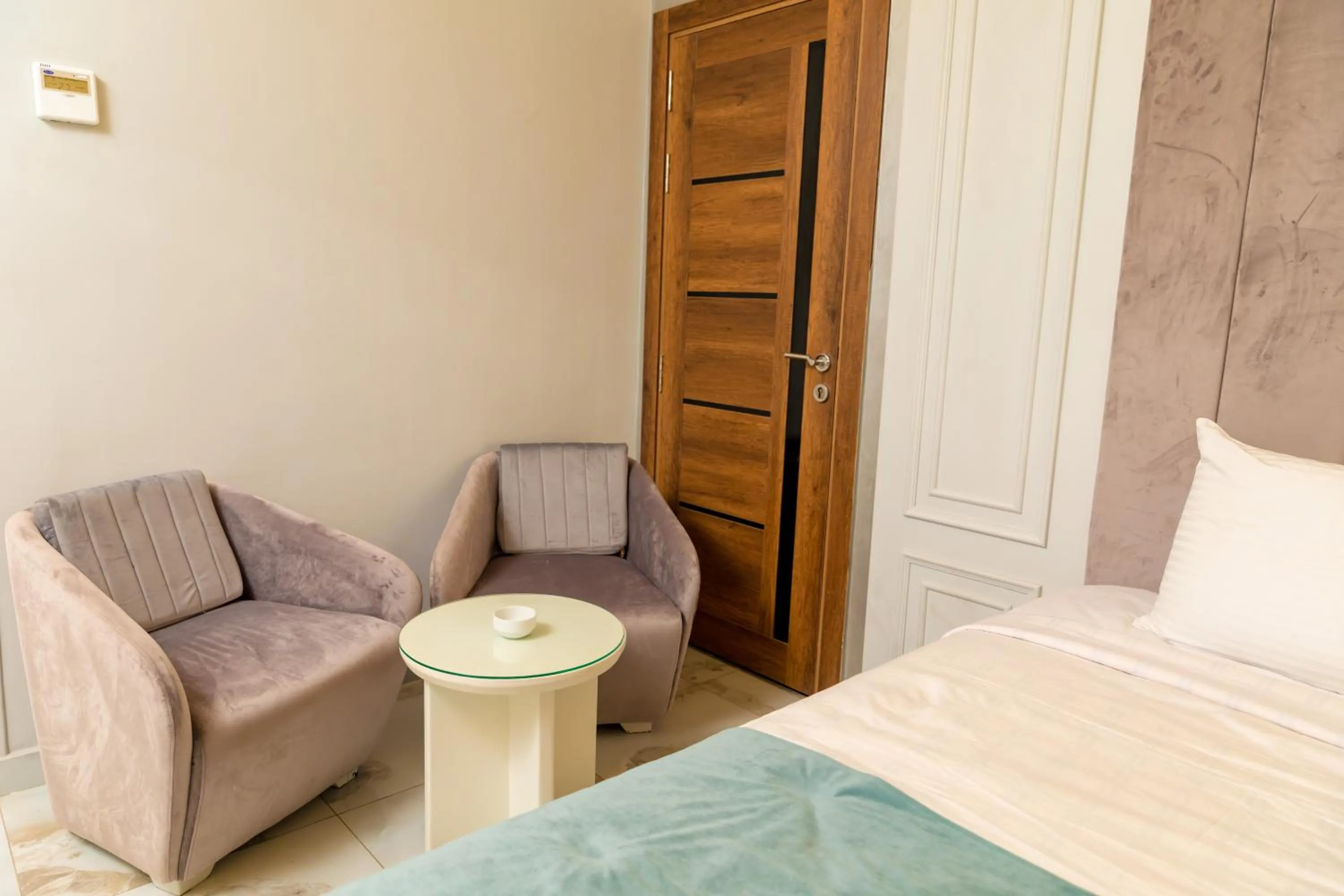 Seating area, Bed in Nile Club hotel