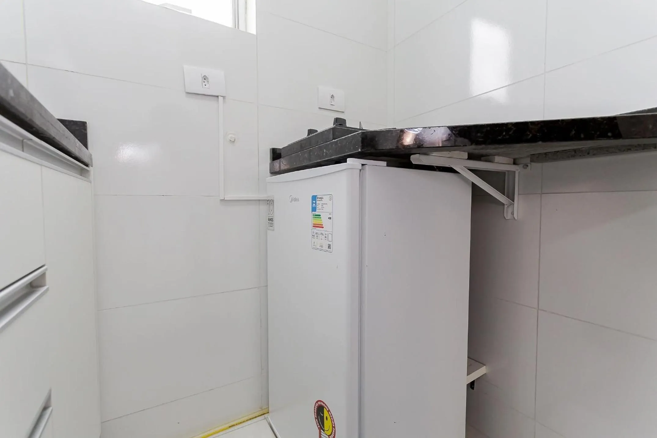 Kitchen or kitchenette in Ed. Charlie Chaplin | Prédio no coração de Curitiba | Gonzaga Stays