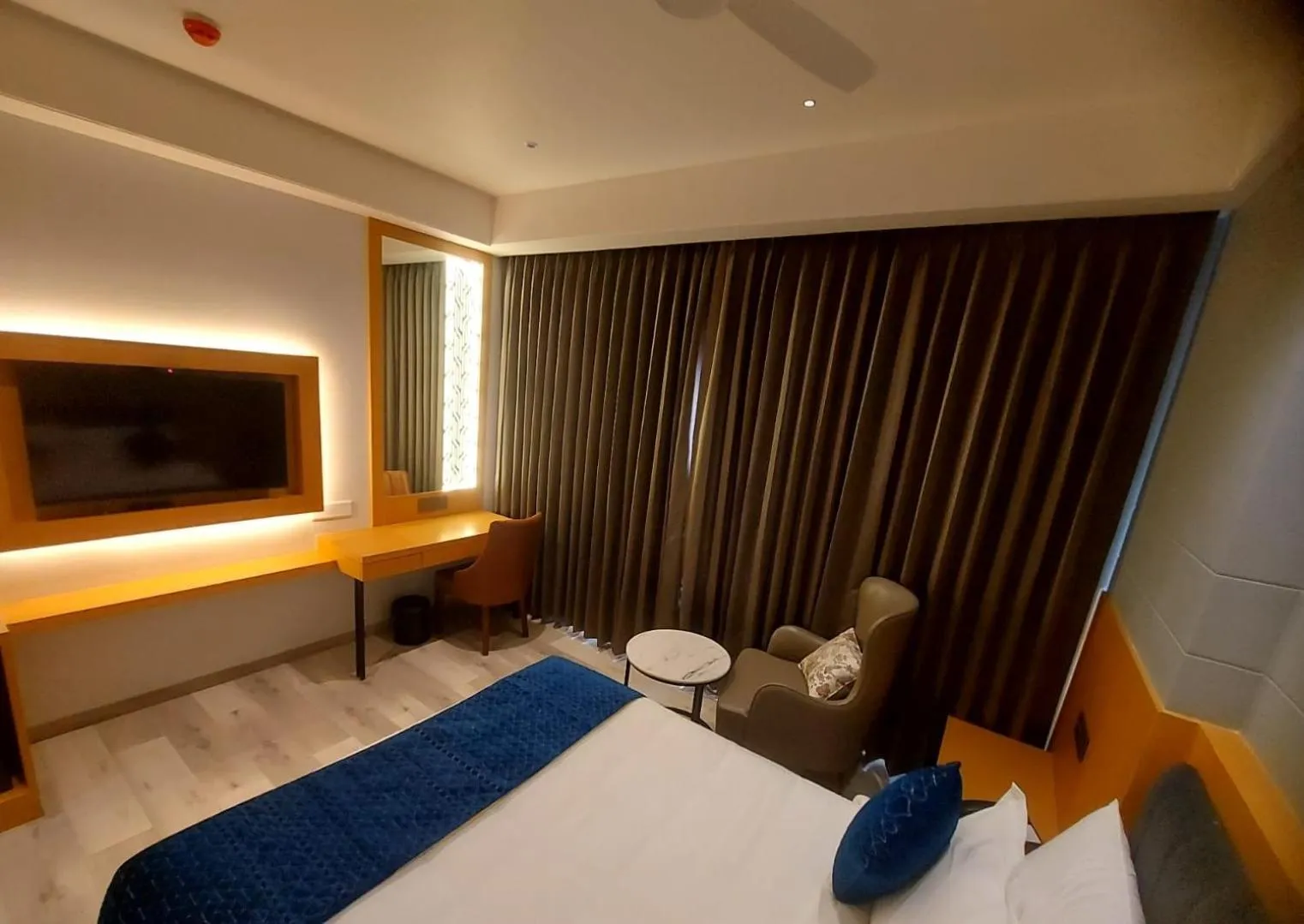 TV and multimedia, Bed in Regenta Inn Bhavani Nellore By Royal Orchid Hotels