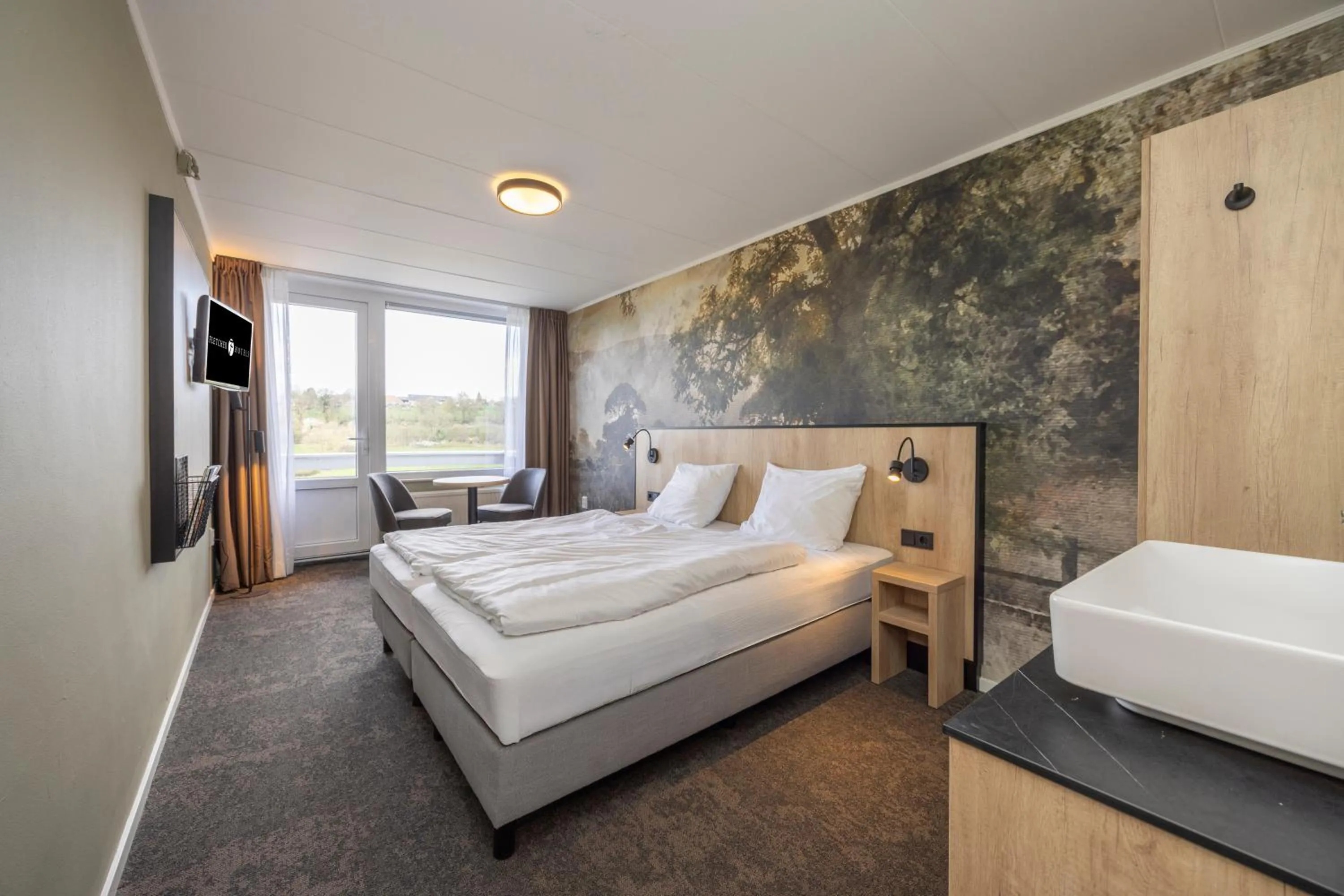 Photo of the whole room, Bed in Fletcher Hotel Restaurant Bon Repos