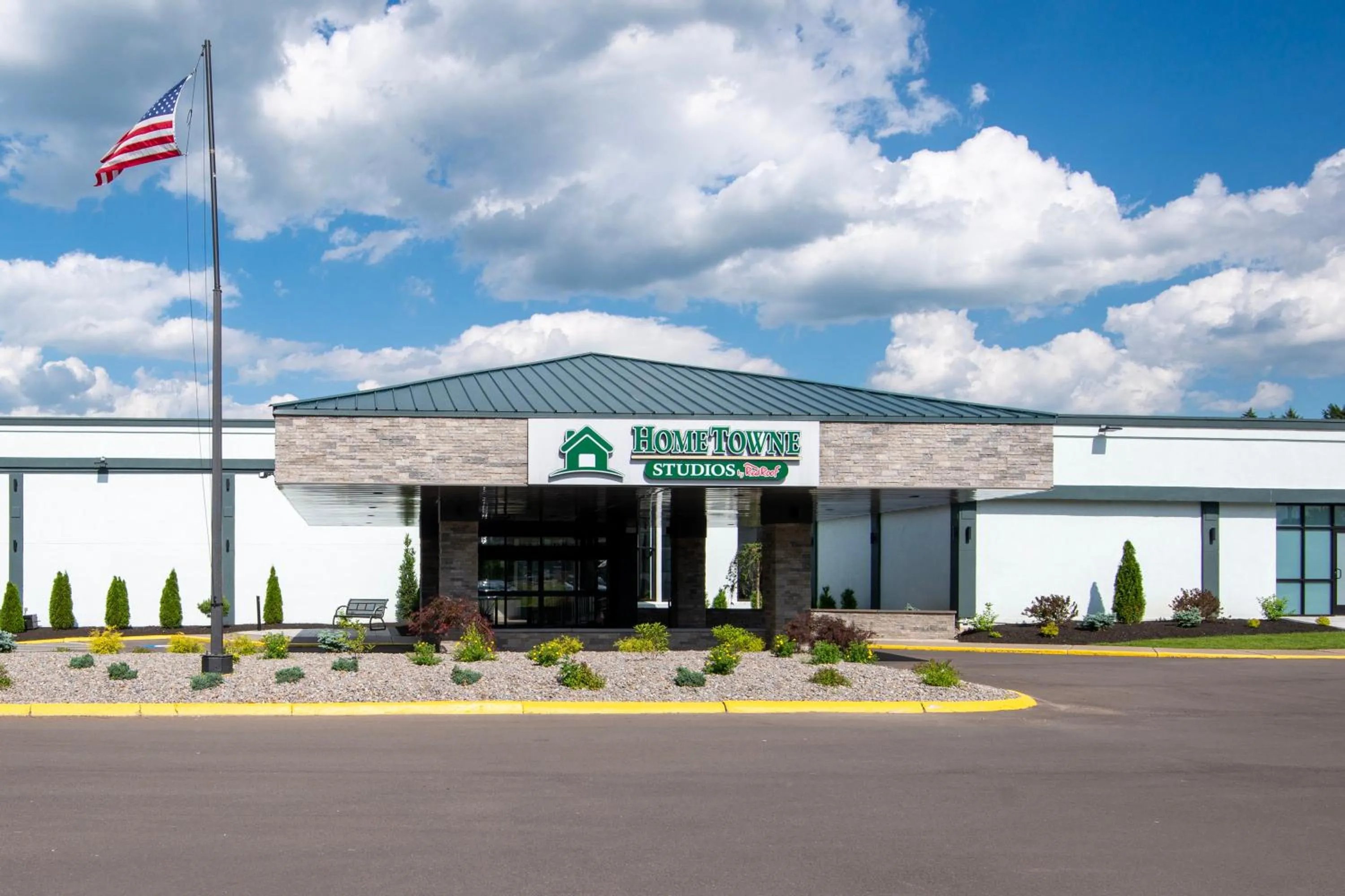 Property building in HomeTowne Studios by Red Roof & Conference Center Cortland