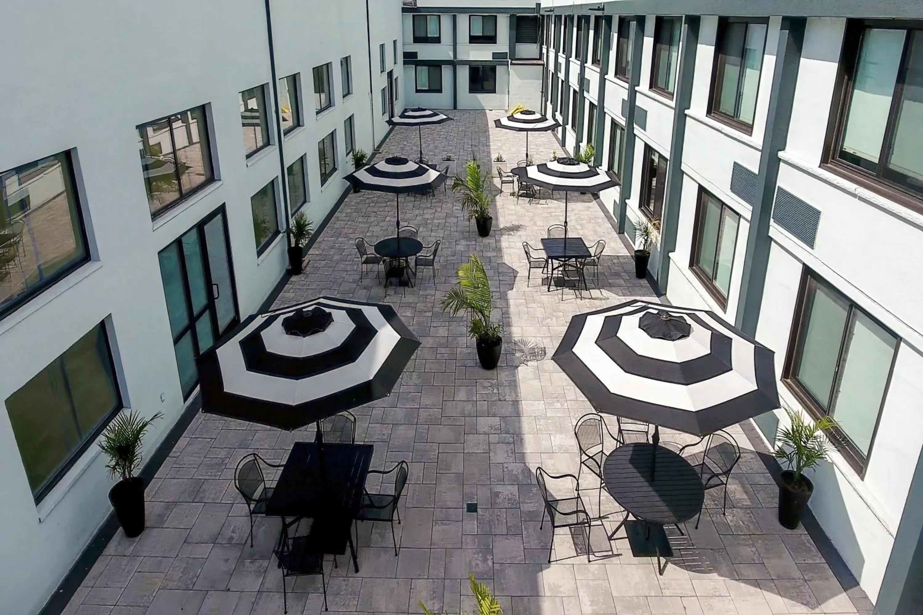 Inner courtyard view in HomeTowne Studios by Red Roof & Conference Center Cortland