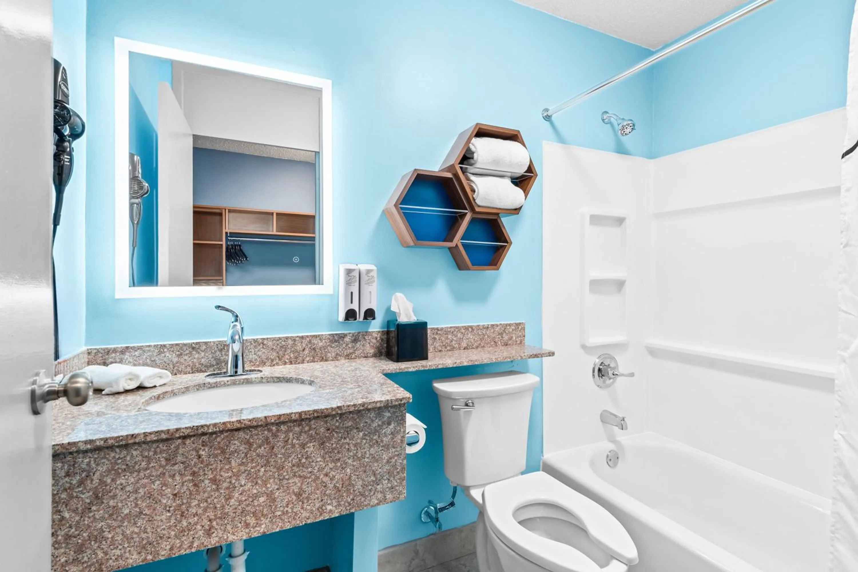 Bathroom in HomeTowne Studios by Red Roof & Conference Center Cortland