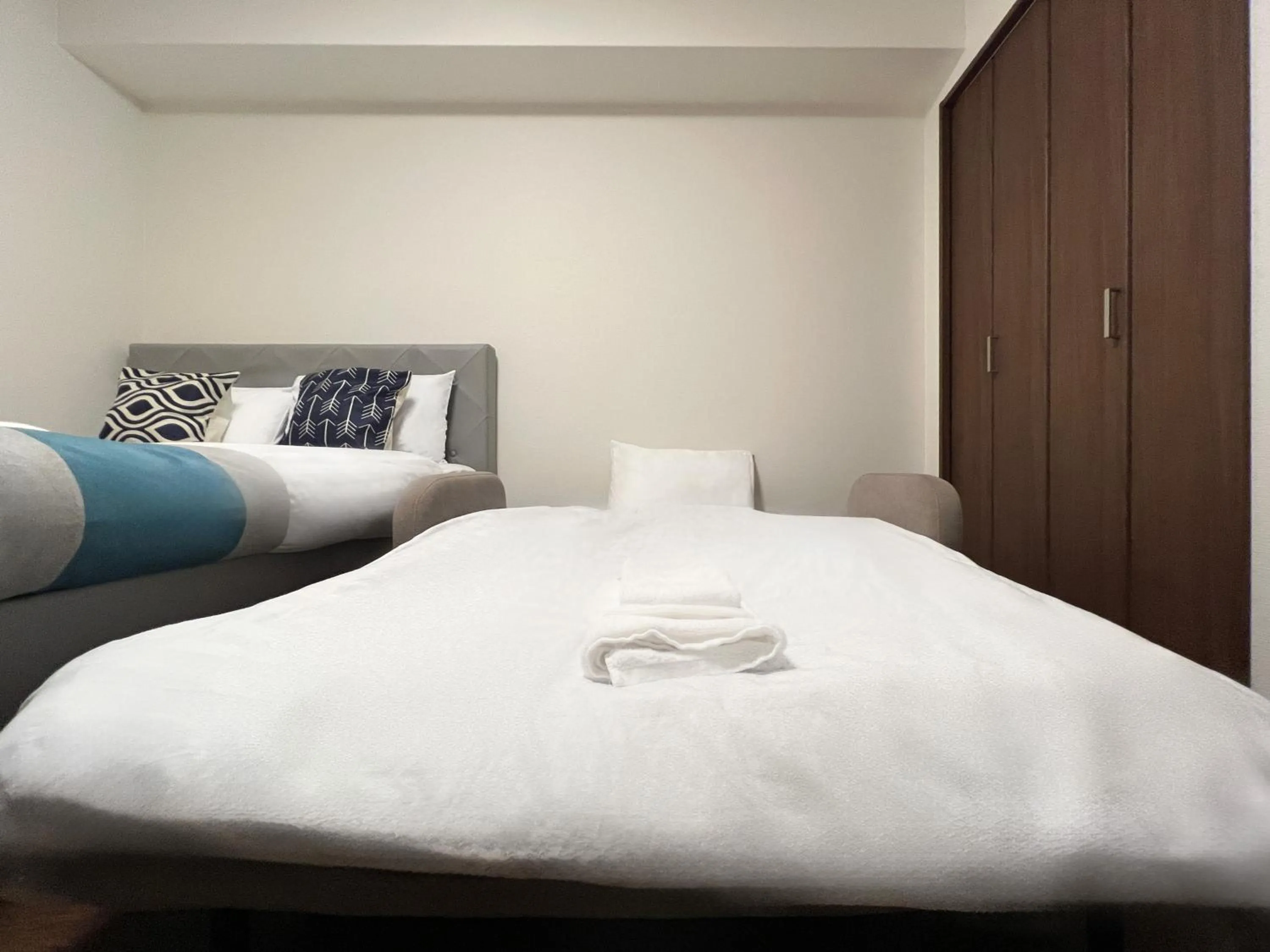 Bed in nestay apartment osaka ebisu